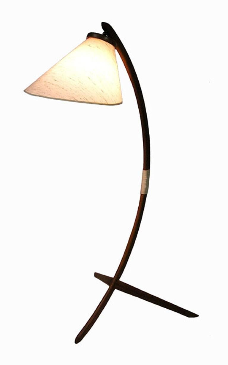 A stunning teak floor lamp from the 1960s Danish modern era. Commonly referred to as a 