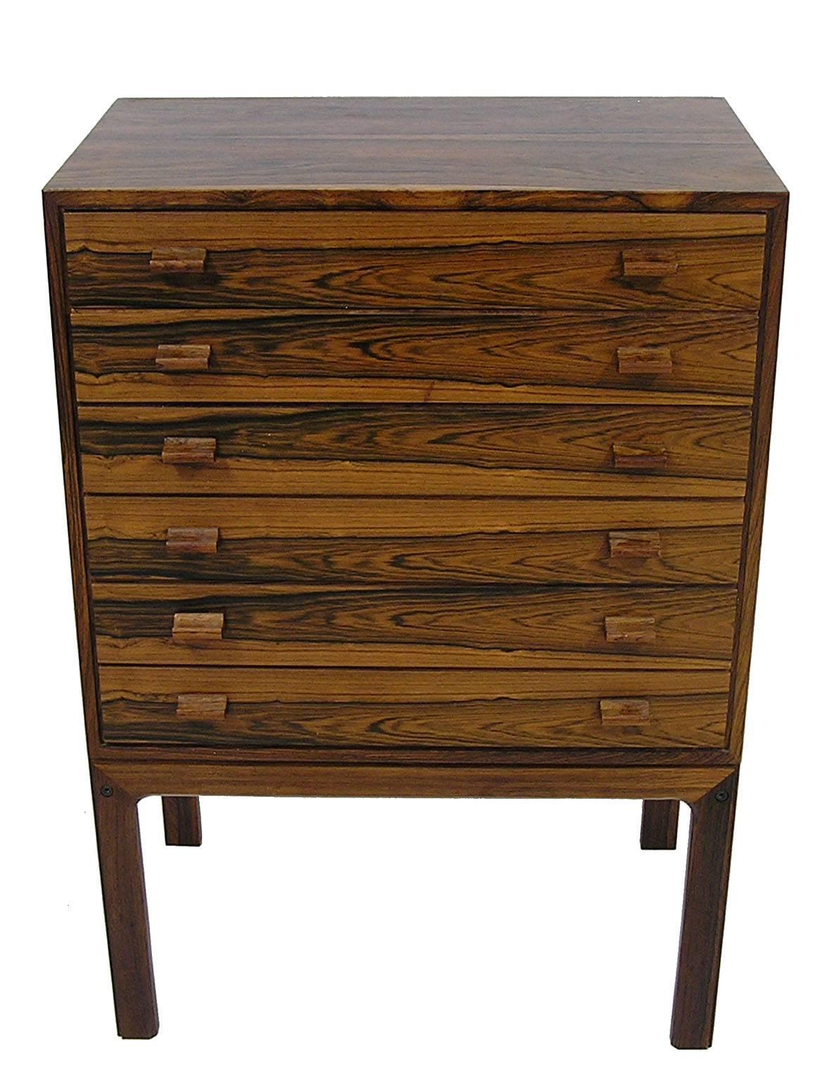 A gorgeous Brazilian rosewood chest from the 1960s Danish modern era. Nice compact size with six slender drawers measuring 20 1/2