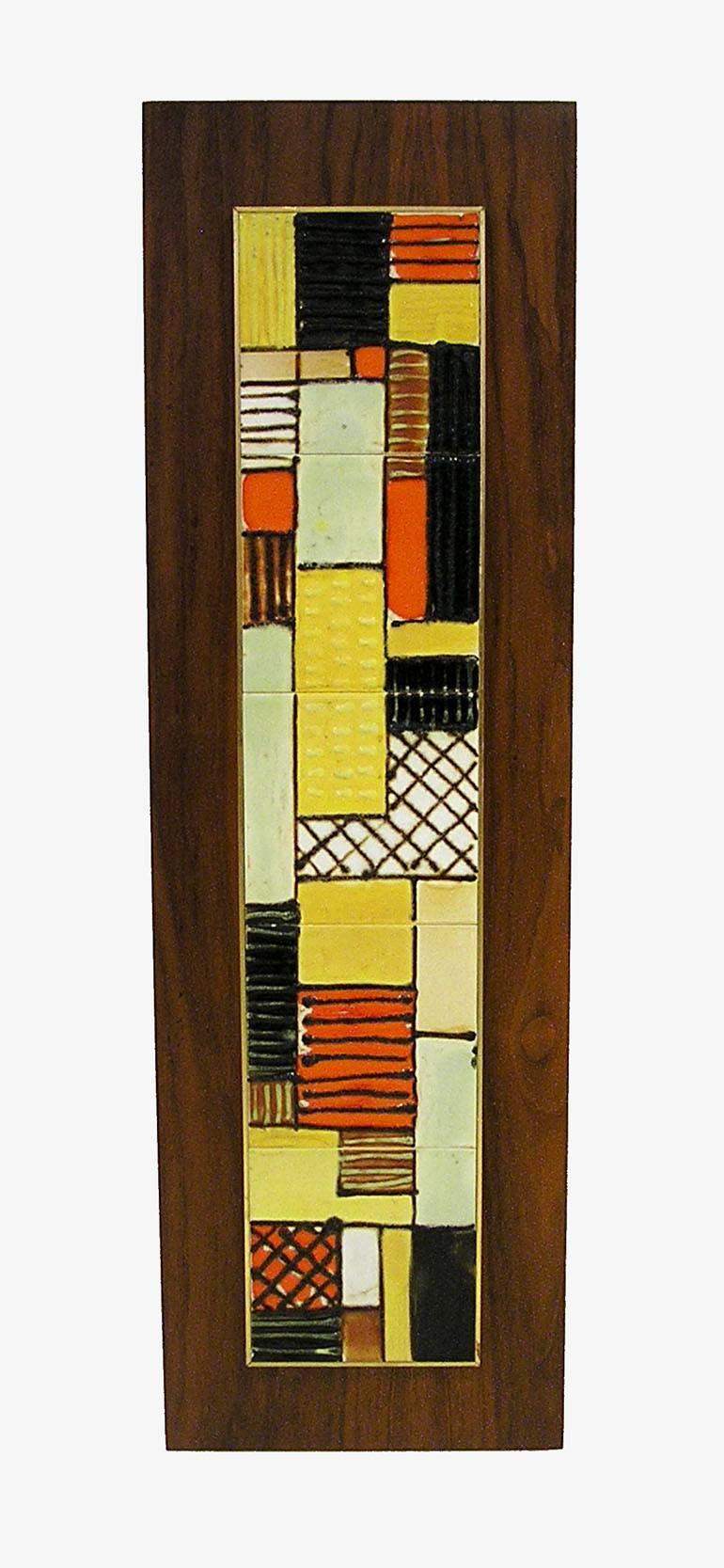 A handcrafted tile art wall plaque from the 1950s Mid-Century Modern era by Harris G. Strong. Features a unique abstract design with beautifully colored ceramic tiling set on a walnut plaque. Plaque can be hung either vertically or horizontally and