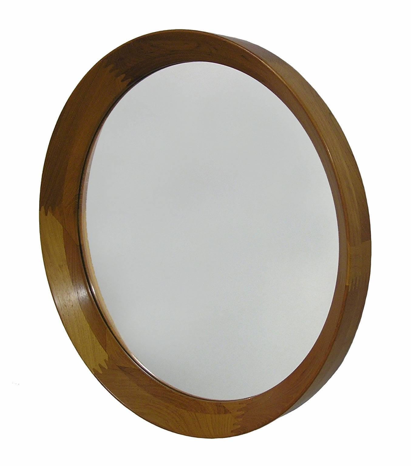 A quality round teak wall mirror from the 1960s by Pederson & Hansen of Denmark. Stunning workmanship throughout featuring a 2