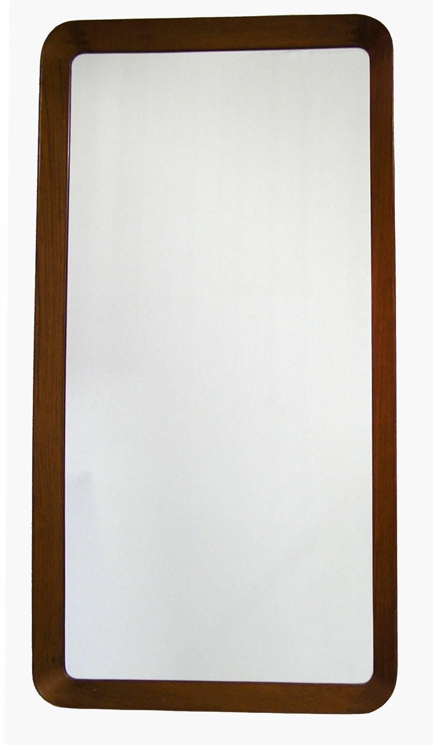 A teak wall mirror from the 1960s by Pederson & Hansen of Denmark. Quality workmanship throughout featuring a 2