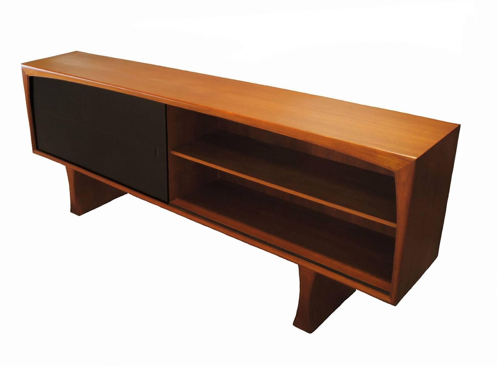 A gorgeous Danish modern era teak hutch from the 1960s. Attributed in design to Kai Kristiansen of Denmark and assembled in Canada by A. Jensen & Son Limited. Quality craftsmanship throughout with an attractive shapely trim and sculpted form