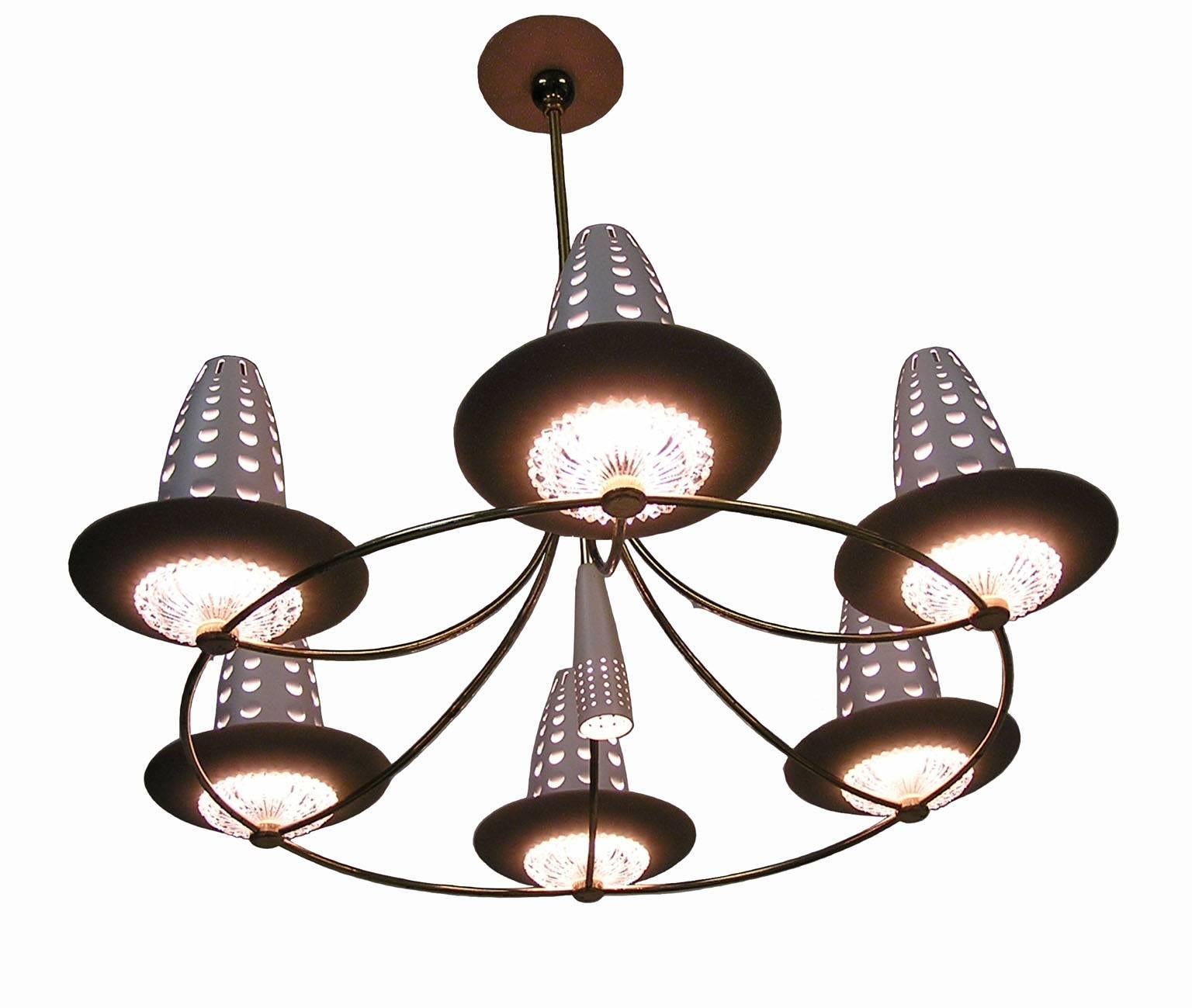 A stunning six-branch brass and glass chandelier by one of the notable lighting designer's of the Mid-Century Modern era. Designed by Gerald Thurston for Lightolier in the 1950s and featuring six branched sockets with beautifully crafted lower