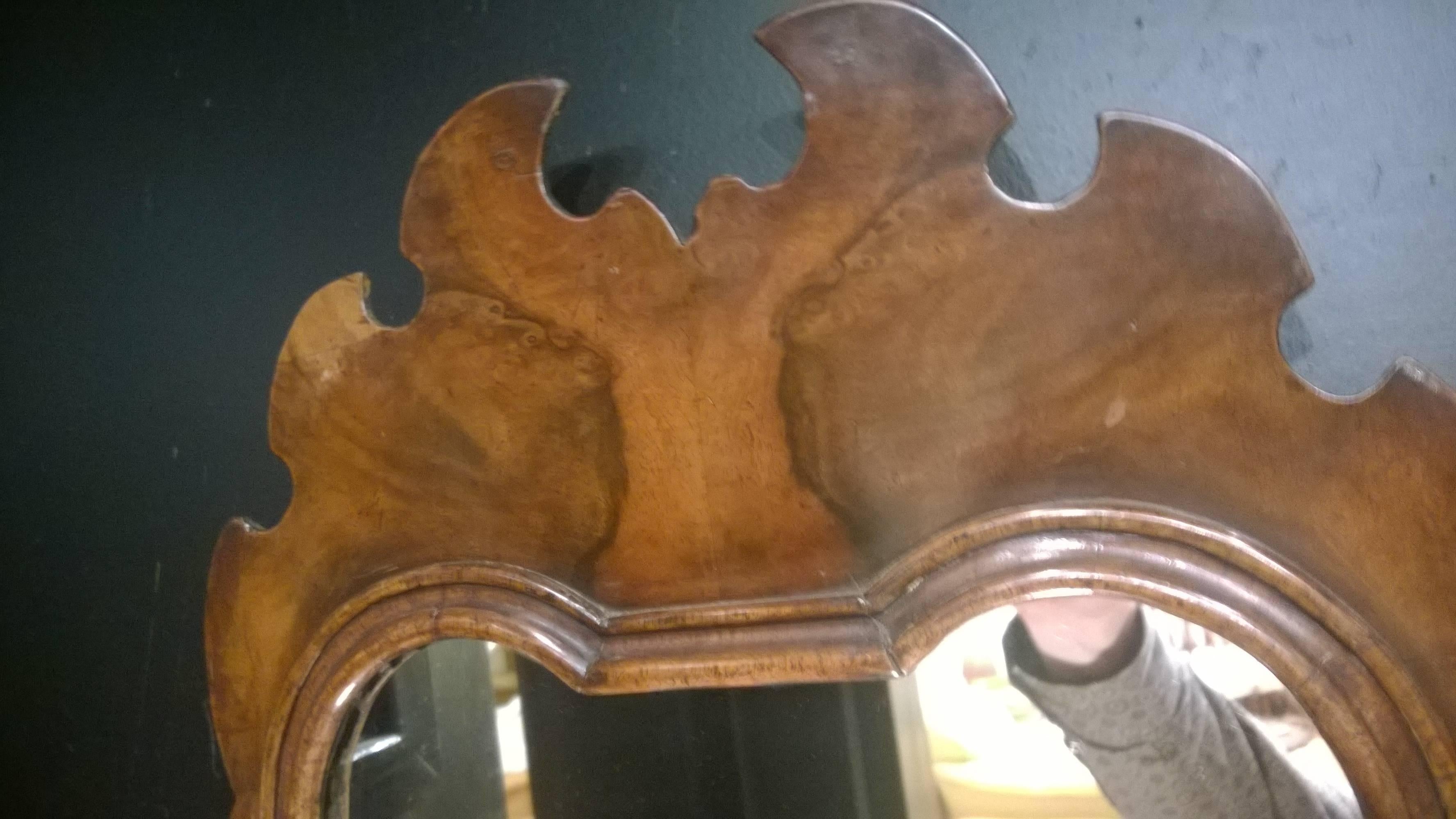 Walnut framed Chippendale style mirror, circa 1910. Measures: 13