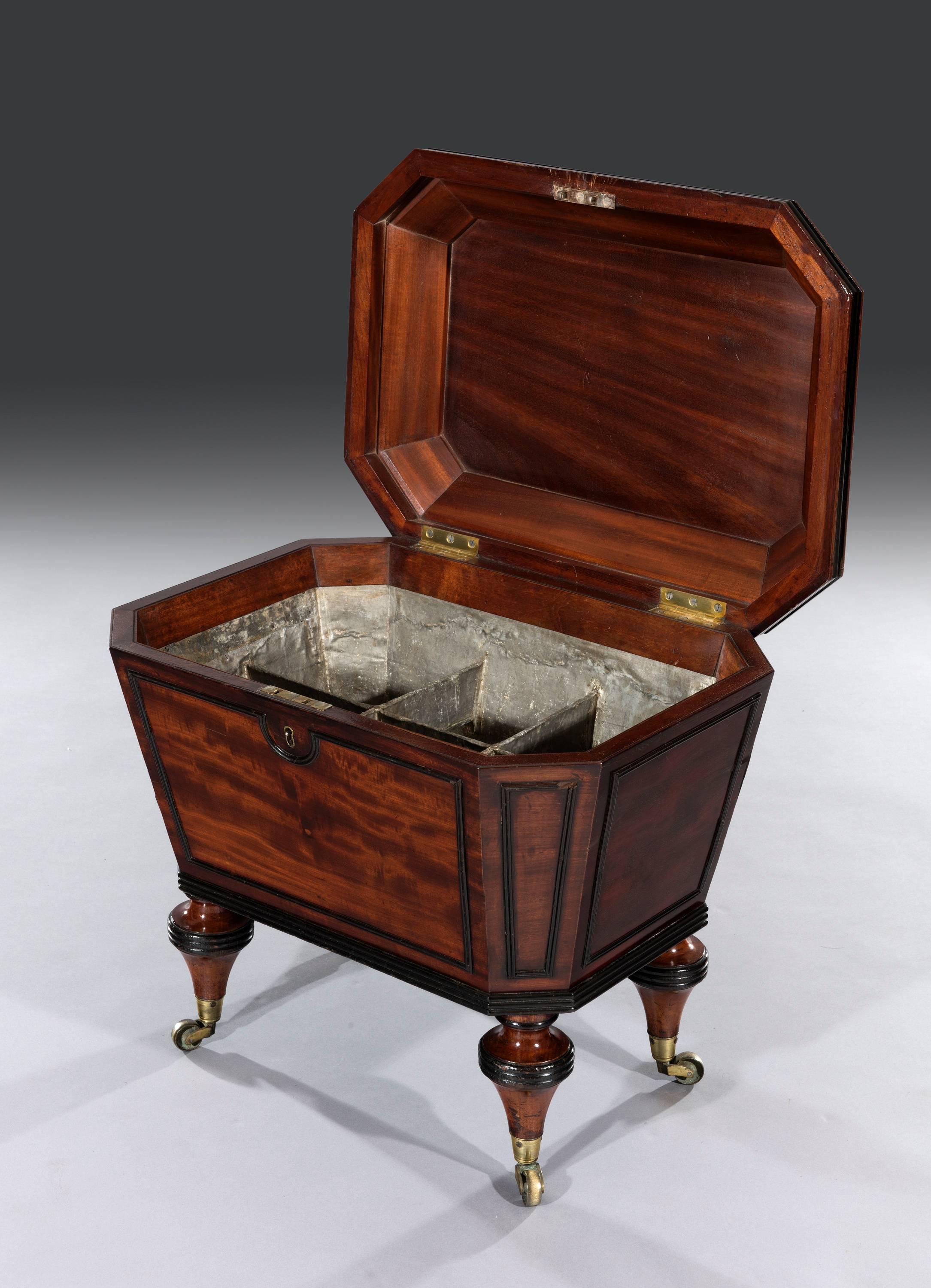 Regency mahogany wine cooler cellaret with ebony beeding turned tapered legs and lead lined compartments.
Measures: 24