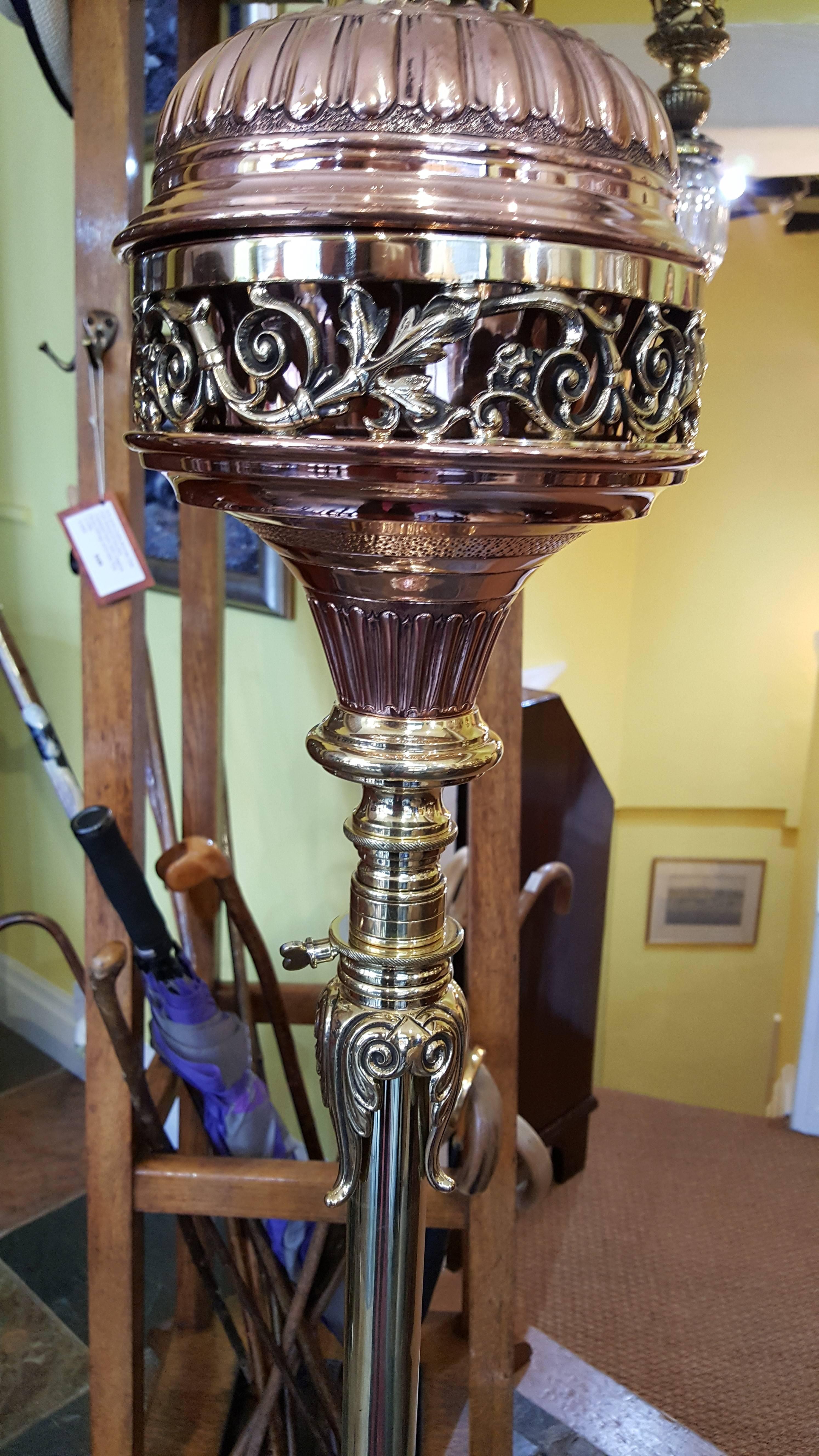 Art Nouveau Hinks & Sons copper and brass telescopic standard oil lamp with pierced and cast foliate design, raised on three foliate bracket supports converted to electric
The lampshade(s) are newly handmade silks by the same maker as provides the