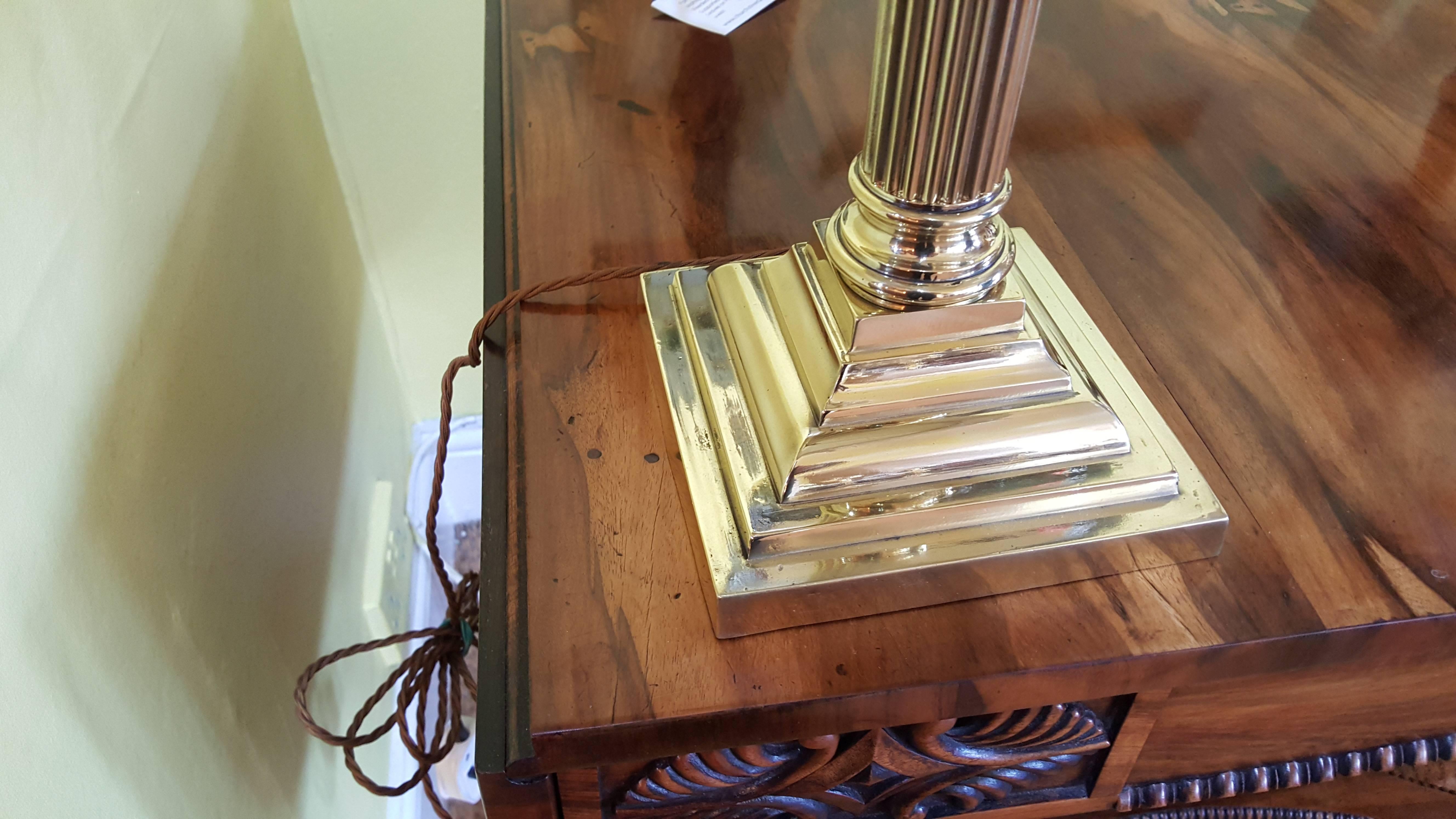 Edwardian brass table lamp in the form of a Corinthian column on a platform base
14