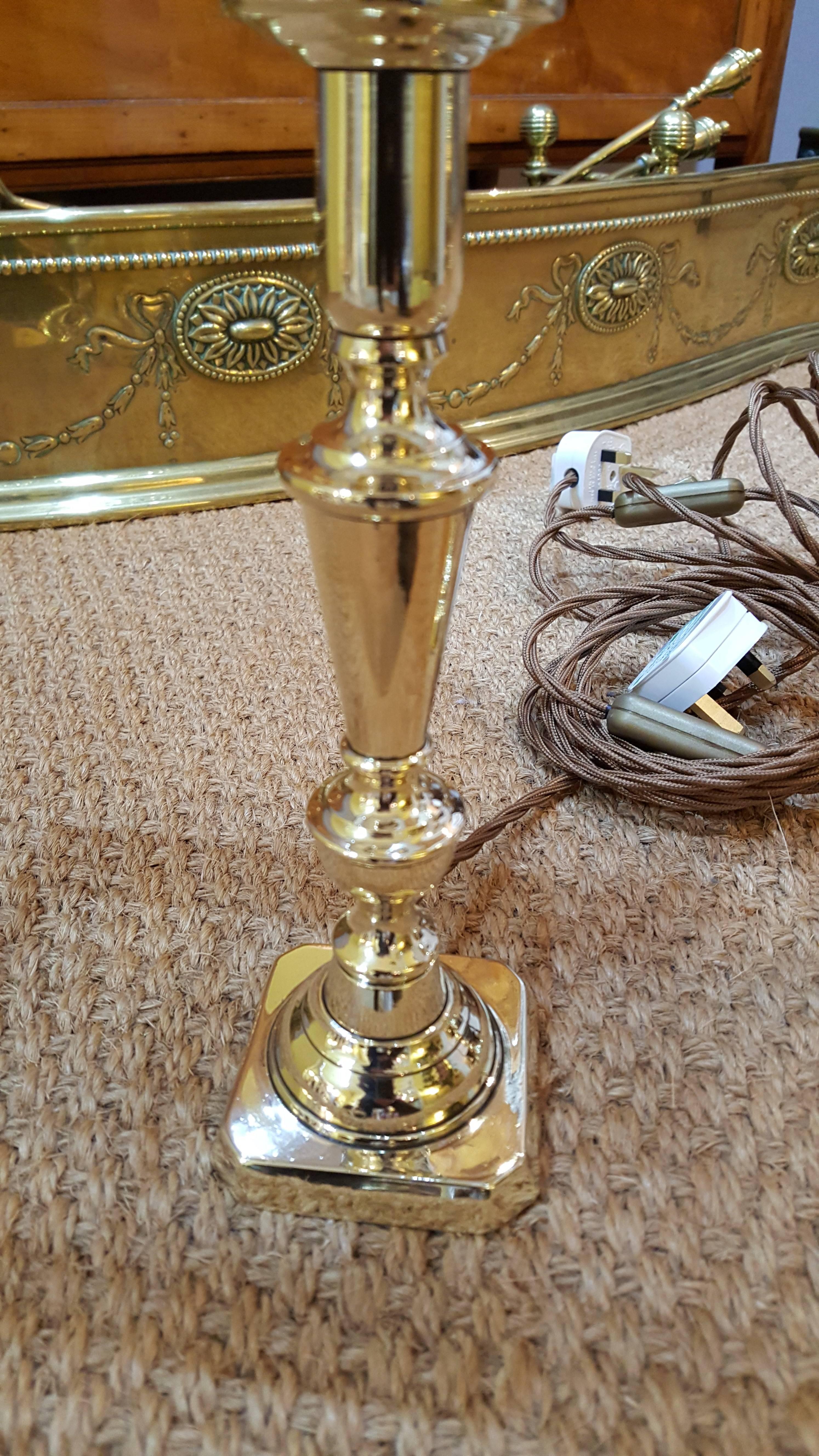 Pair of Edwardian brass candlesticks converted to electric table lights - all lights and lamps have been rewired with authentic corded flex, fitted with either foot switch or finger clicker switch and are Pat tested -
Measures: 6