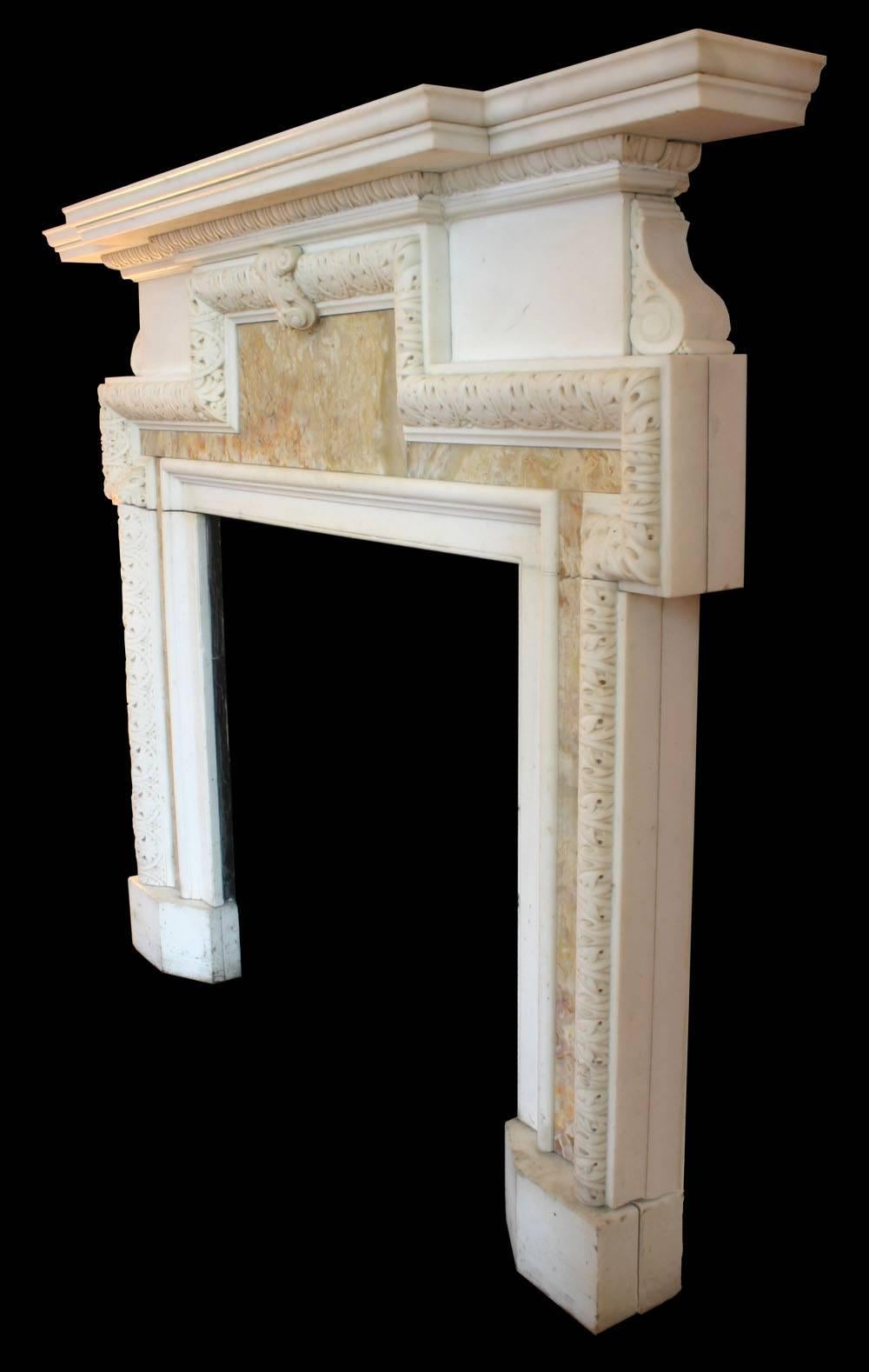 Very fine antique late Georgian statuary white marble chimneypiece with elaborately carved eared moldings which enclose specimen alabaster panels. Images prior to restoration. When this fireplace is purchased it will then be fully restored. The