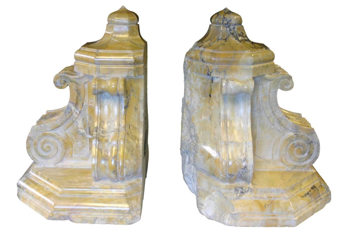 Handsome pair of monumental Baroque sienna marble wall brackets. Late 18th-early 19th century. Probably Italian. Polished to a beautiful patina, with only minor and expected wear.

Size: 43cm high x 41cm wide x 30-35cm deep, 77kg (170lbs) the