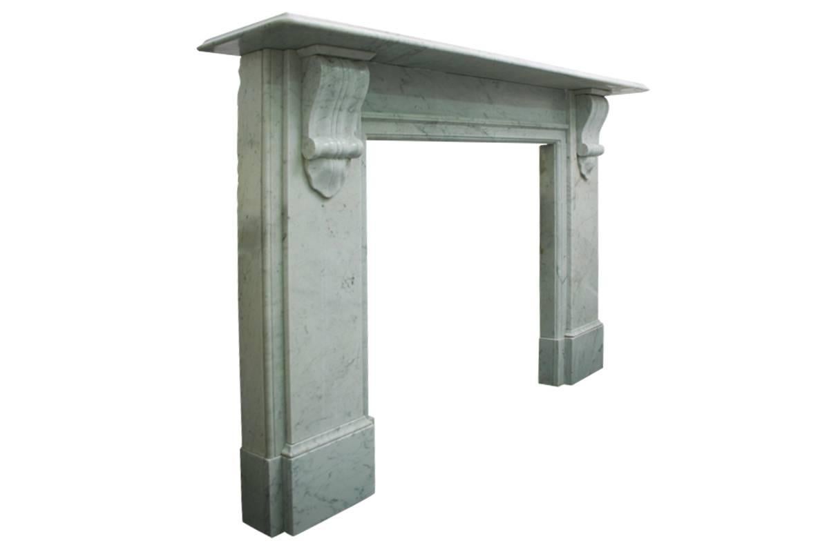 Reclaimed 19th century Carrara marble fireplace surround of good proportions. Carved corbels supporting the shelf, circa 1870.
