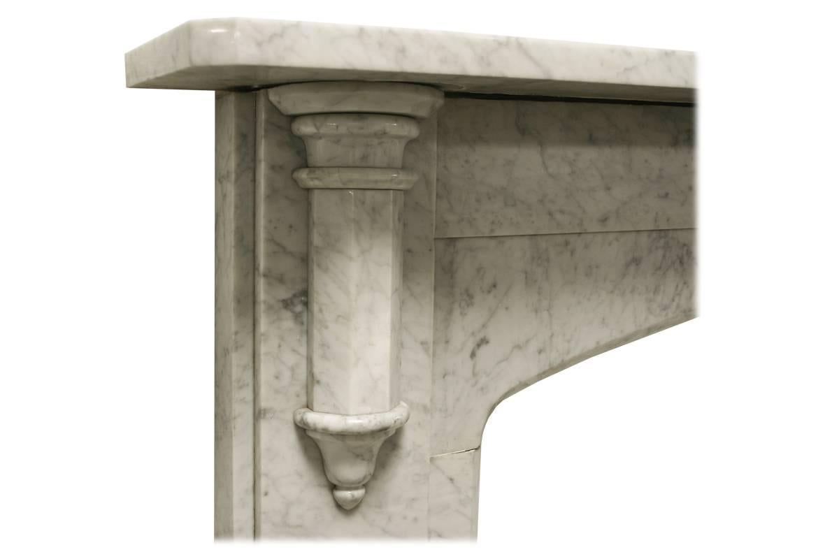 Antique reclaimed Victorian Carrara marble fireplace surround with Gothic corbels supporting the shelf and a three point arched aperture, circa 1860.
Images prior to restoration. This chimneypiece is awaiting restoration, please enquire as to the