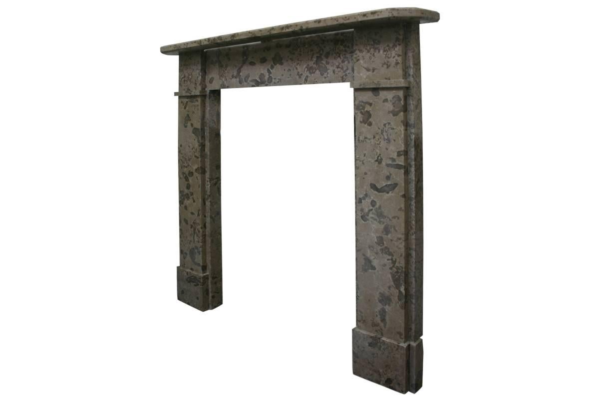 Antique Derbyshire limestone fireplace surround of simple form. Square capital sit above plain jambs and support the mantel with chamfered corners. We currently have an identical pair of these surrounds available. (Priced individually),
circa