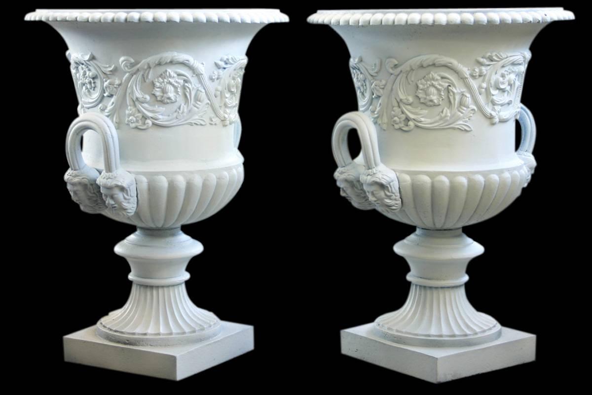 Antique pair of large Victorian cast iron garden urns with mask head loop handles and a continuous band of foliate decoration, made by the Handyside Foundry of Derby.
Primed ready for painting.