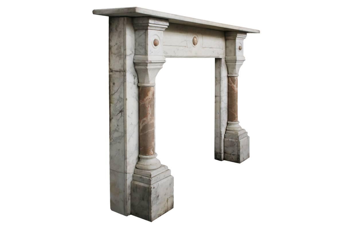 Large antique late Victorian Carrara marble fireplace surround, with crema valencia marble pillars and decoration to the capitals. Images prior to restoration, circa 1860.
This fireplace is awaiting restoration, please enquire about the lead time