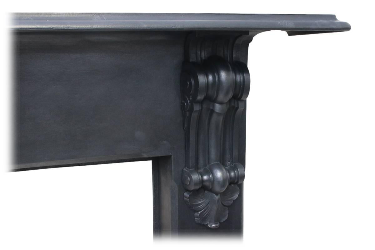 Reclaimed 19th century cast iron fireplace surround of simple form with well cast corbels supporting the shelf. Produced by the Falkirk foundry, dated 1871.

This fireplace has been finished the traditional black grate polish, leaving a gun metal