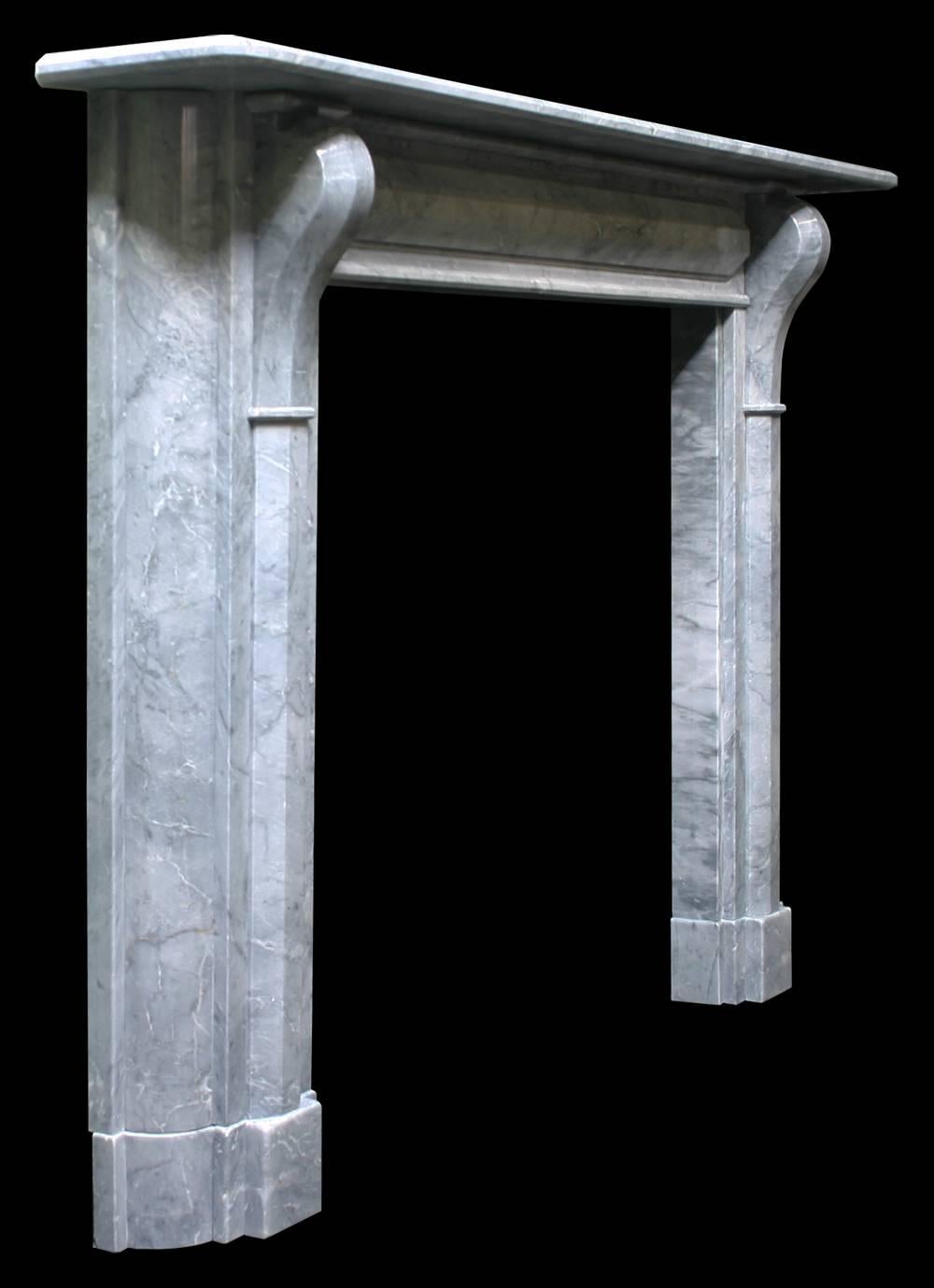 A restored large antique Regency fireplace surround in Bardiglio grey marble with applied cushion moulding to the frieze and jambs and simple corbels supporting the shelf.
Measures: Shelf 73.5