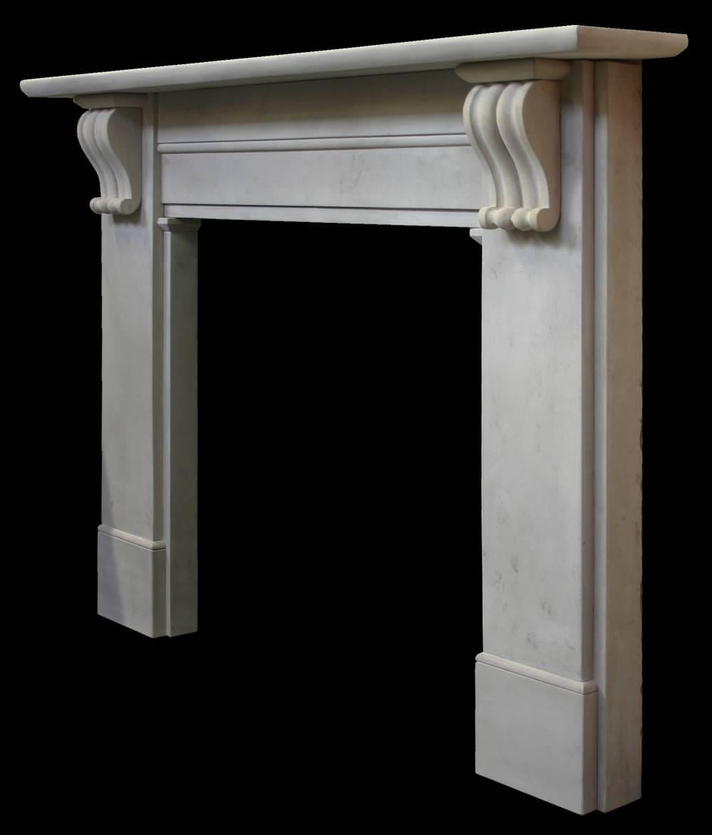Antique mid-Victorian stone fire surround with carved corbels supporting the shelf. Pictured with an Victorian cast iron arched grate, sold separately. 