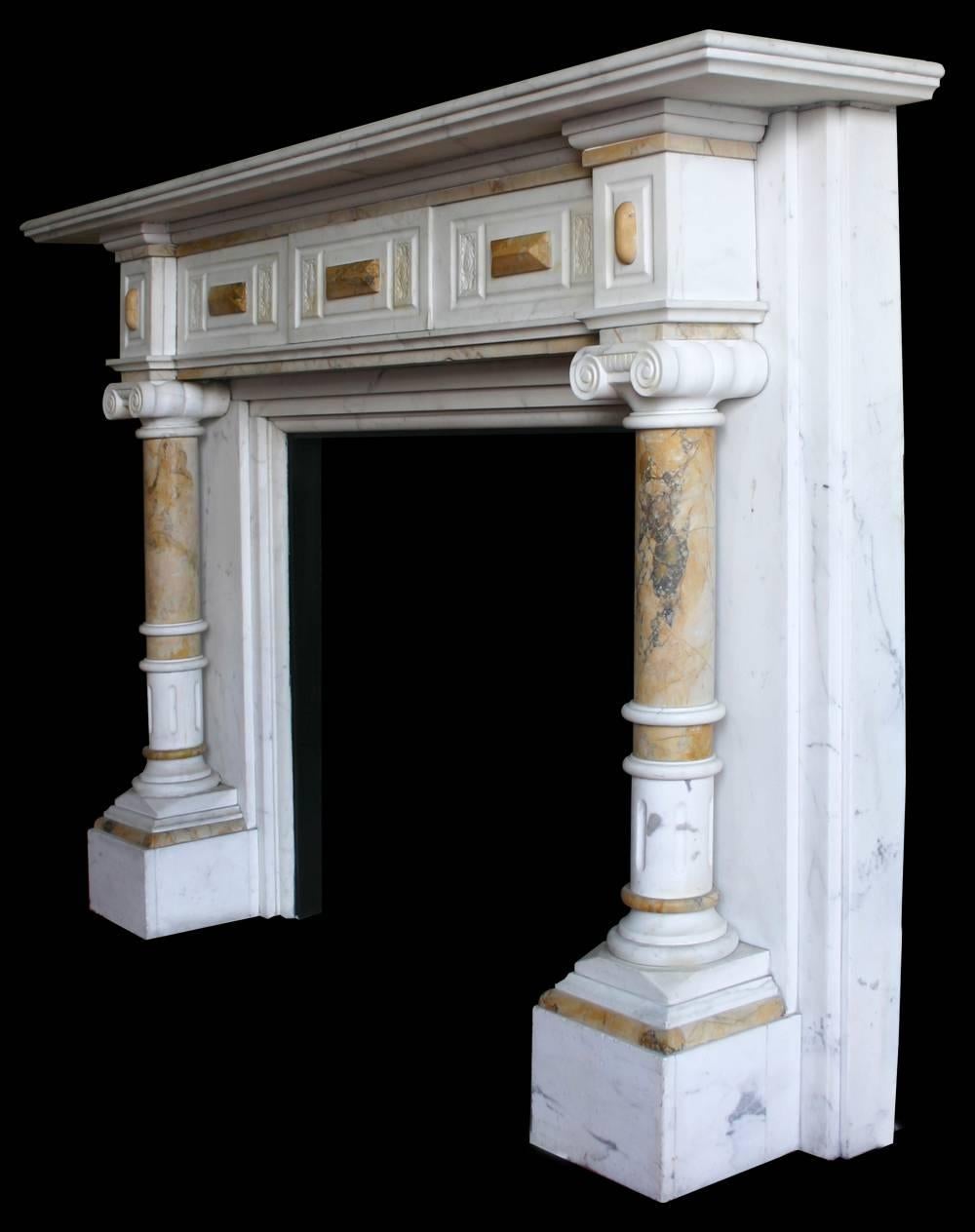 Very imposing antique late Victorian statuary white marble fire surround with Sienna marble pillars supporting square capitals and a frieze decorated with sienna marble lozenges and carved panels,

circa 1880.

Images prior to restoration. When