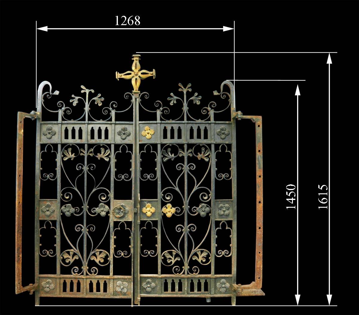 A pair of very decorative 19th century wrought iron gates with brass mounts, with original hinges. 

Measures: Overall width 51.25