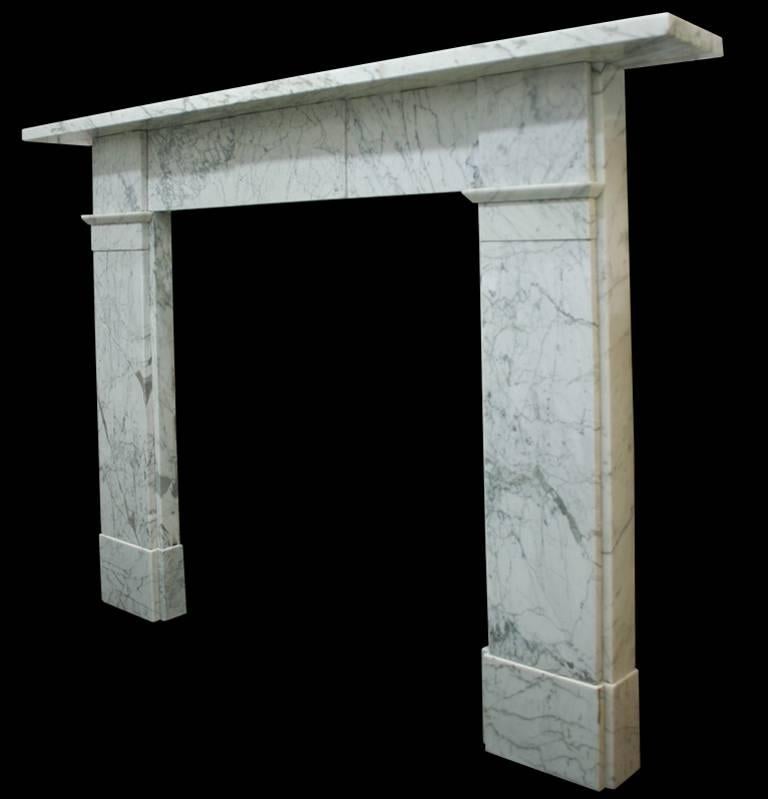 Early Victorian Carrara marble fireplace surround of simple construction. The breakfront frieze terminates in square capitals above plain jambs and boxed plinths.
Measures:
Shelf length 65.5