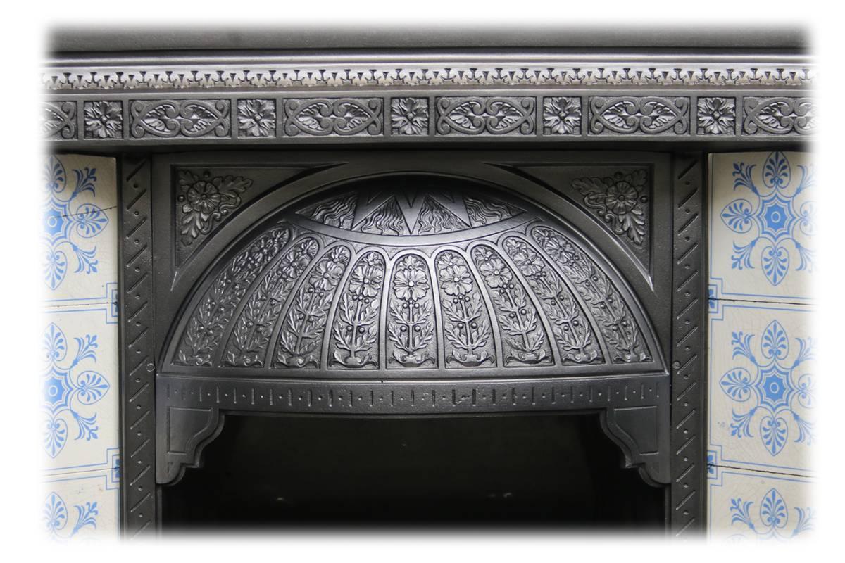 Large antique Victorian cast iron fireplace insert with finely cast detail to the domed hood and frame. Complete with unusual bow fronted bars to compliment the hood and polished brass sliding damper to the ash tidy. 
Complete with a set of original