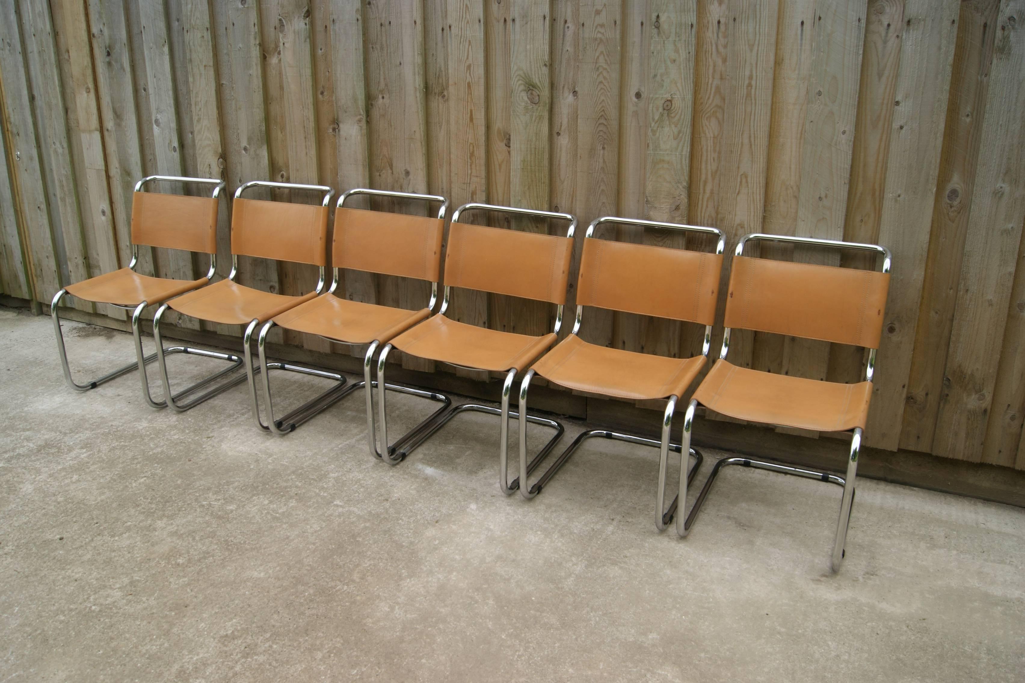 Set of six Bauhaus chairs designed by Mart Stam for Fasem Italy. The chairs feature a tubular steel frame, with thick saddle leather seat and backrest in tan. The chairs are in a good vintage condition, wear and tear consistent with age. With some