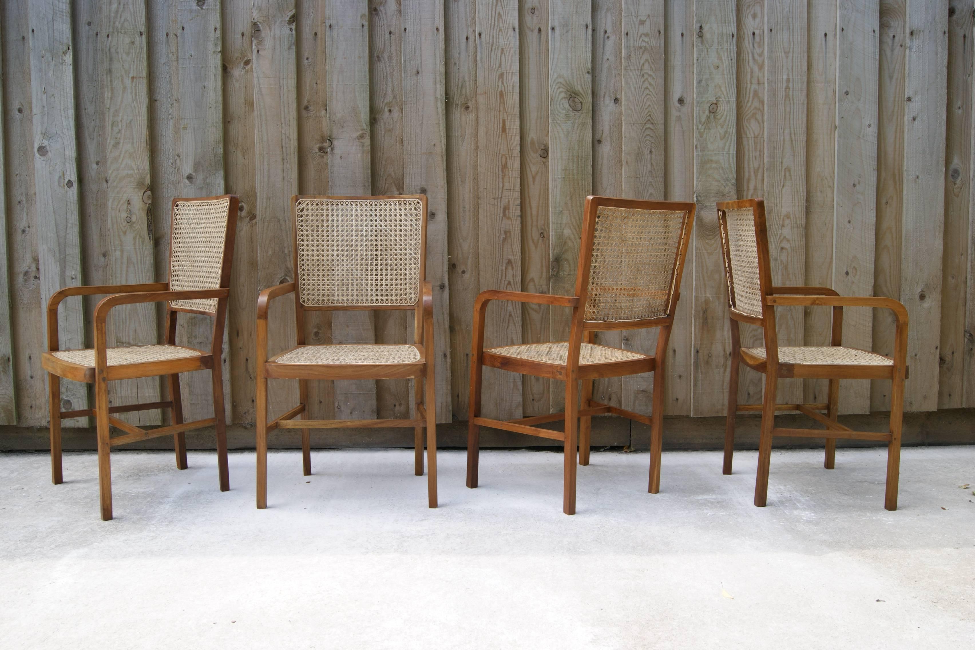 Elegant and unique South Asian armchairs. Complete set of 10, being sold singularly. Price is per chair.

Sympathetically restored, teak frame with natural handwoven cane seat and back.

Tropical modernism period, circa 1950.

Same period as