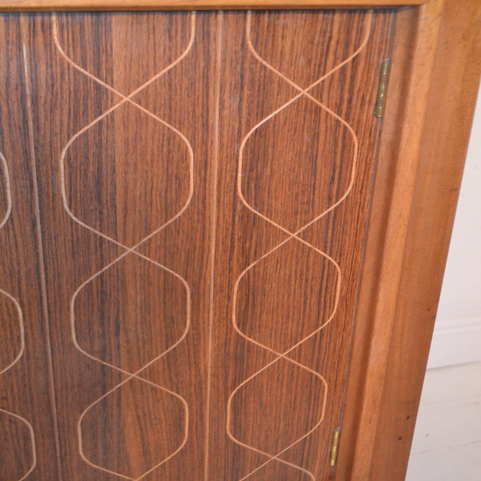 Rosewood and mahogany 'Double Helix' sideboard designed by David Booth and Judith Ledeboer for Gordon Russell of Broadway for the Festival of Britain in 1953.

Free UK Mainland delivery.

World-wide shipping available - please contact us for a