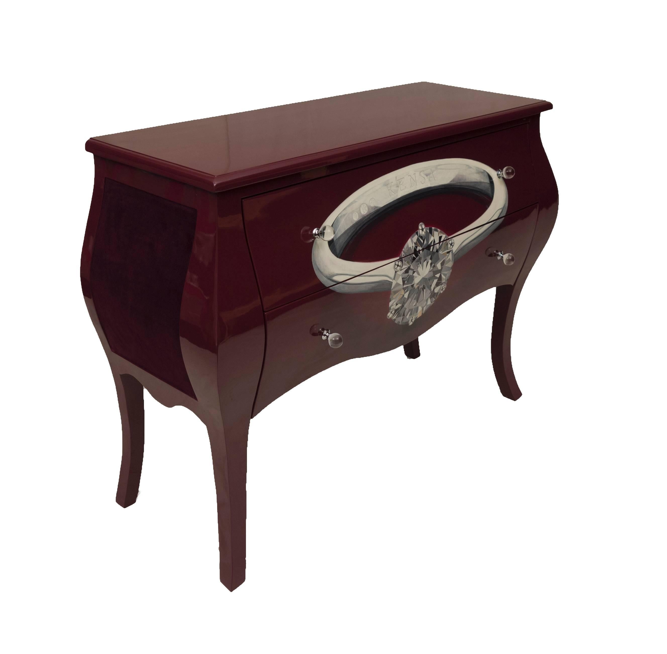 This richly lacquered sideboard with hand-painted diamond ring is ideal to complement both functional and contemporary interiors. 

This hardwood sideboard compromises of two large drawers lined with purple velvet, the side panels are also lined