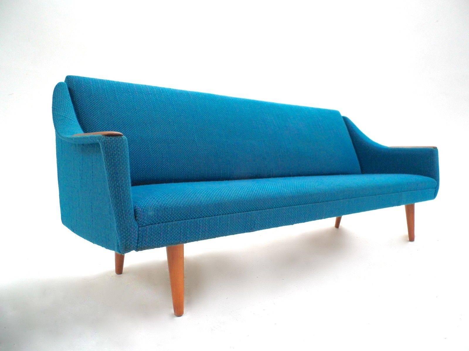 A beautiful Norwegian turquoise blue wool four-seat double sofa bed, this would make a stylish addition to any living or bedroom area. The sofa pulls out into a comfortable sprung double bed. A striking piece of classically designed Scandinavian