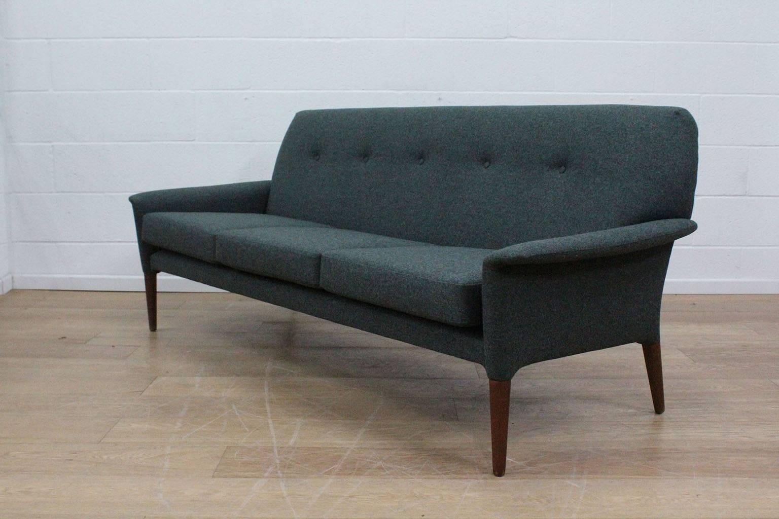 A Hans Olsen designed sofa with much provenance and grace. It has the most beautiful, unusual legs that seem to pour out of the main frame. The angle on those back legs is exquisite and needs to be admired. A collector’s piece but restored with love