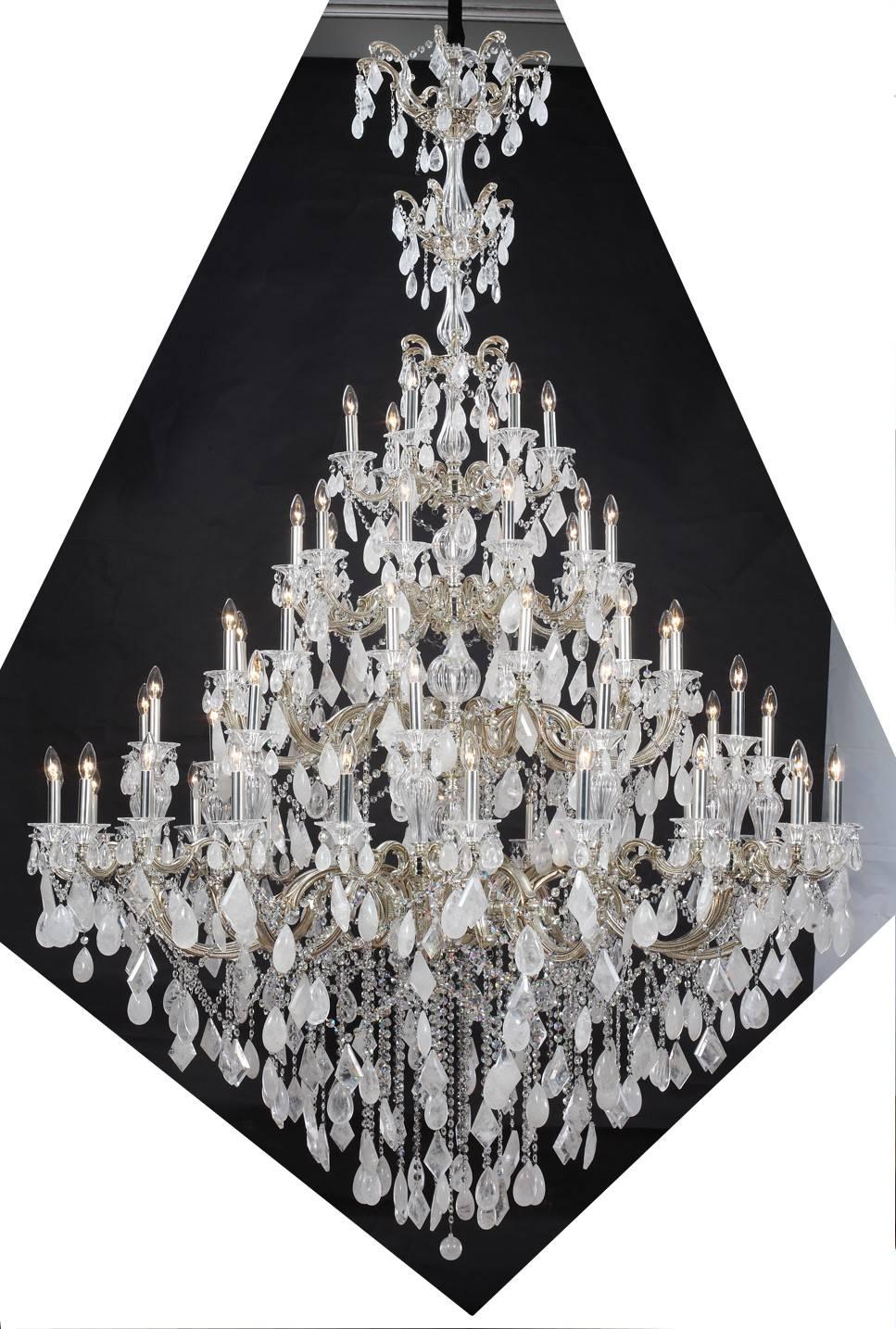 Handcrafted chandelier with cast metal, silver plated scroll detail arms, decorated with a generous covering of real hand cut rock crystal decor, hand-cut crystal glass center body and sconces, creating this luxurious regal sixty-four-light