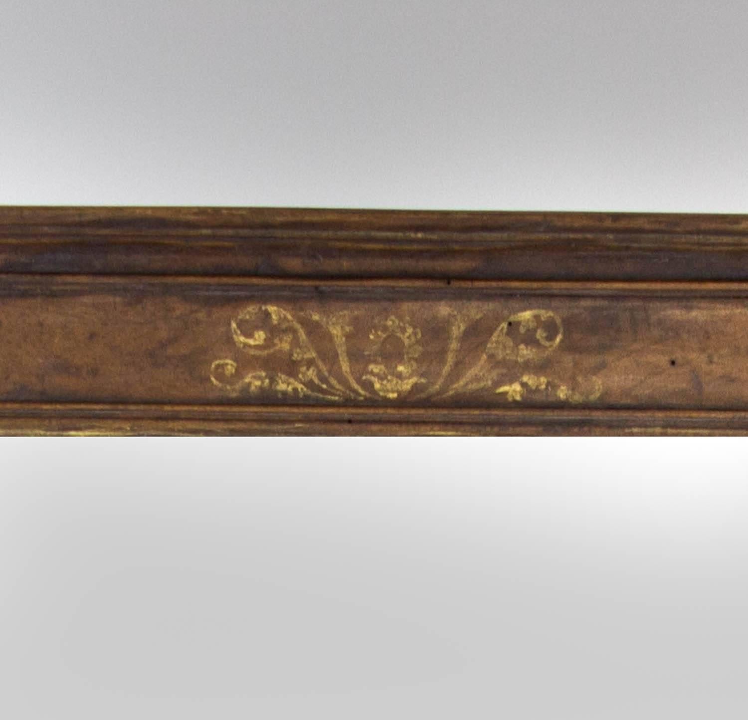17th century Italian mirror with gilded floral decoration.

Measures: 47.5" H x 40" W x 2.5" D.