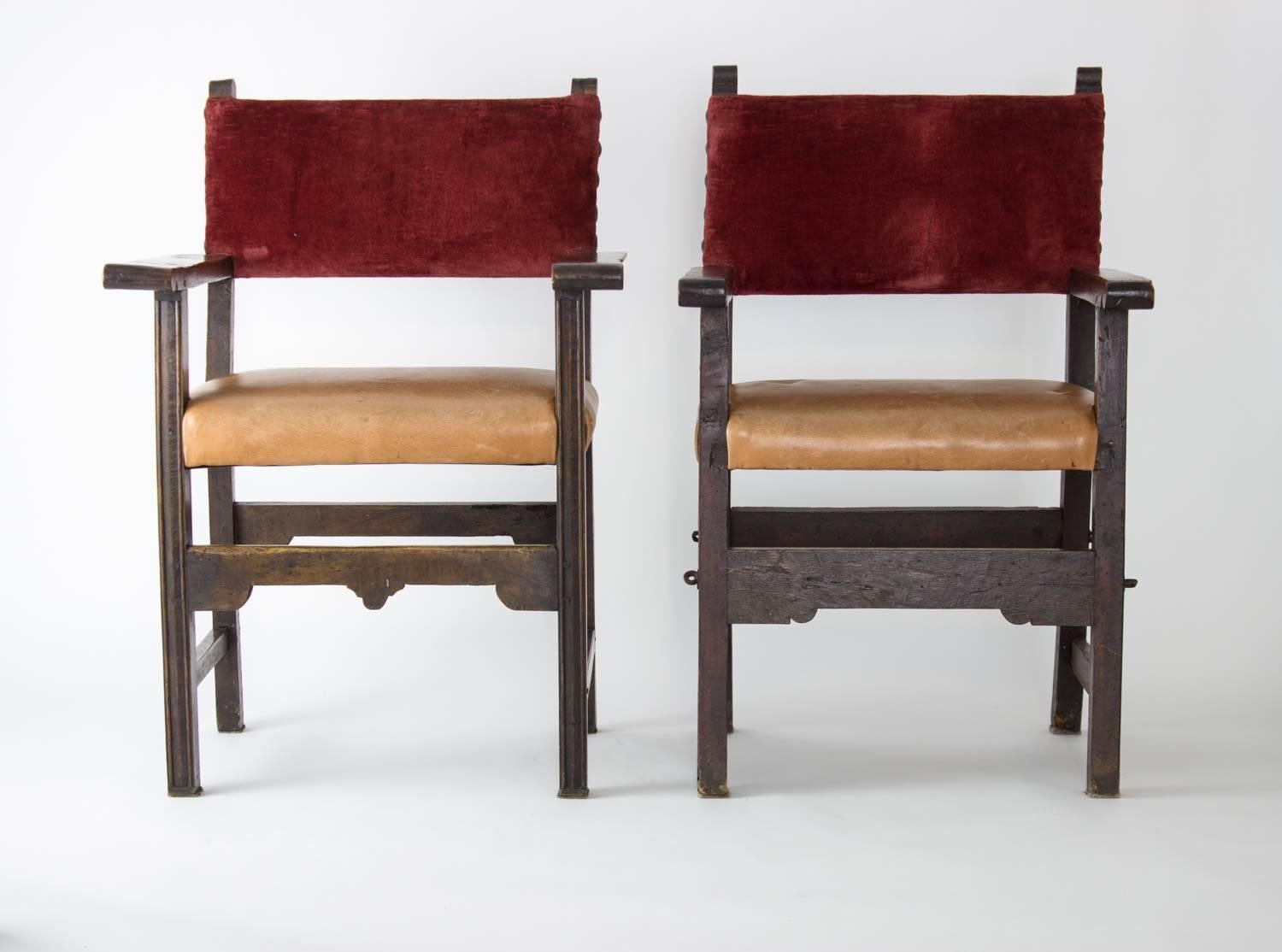 Pair of 18th century English “King and Queen” chairs, restored with reupholstery in 1997; original crest retained.