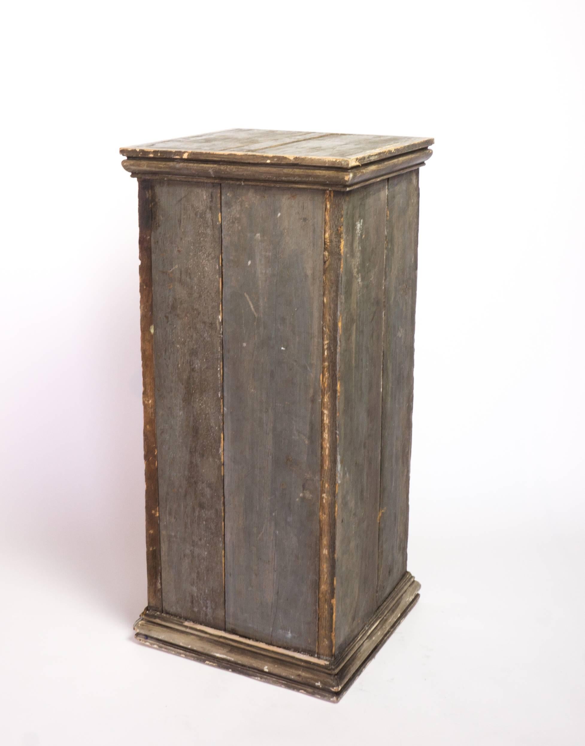 Early 20th century wood painted pedestal in original grey finish.