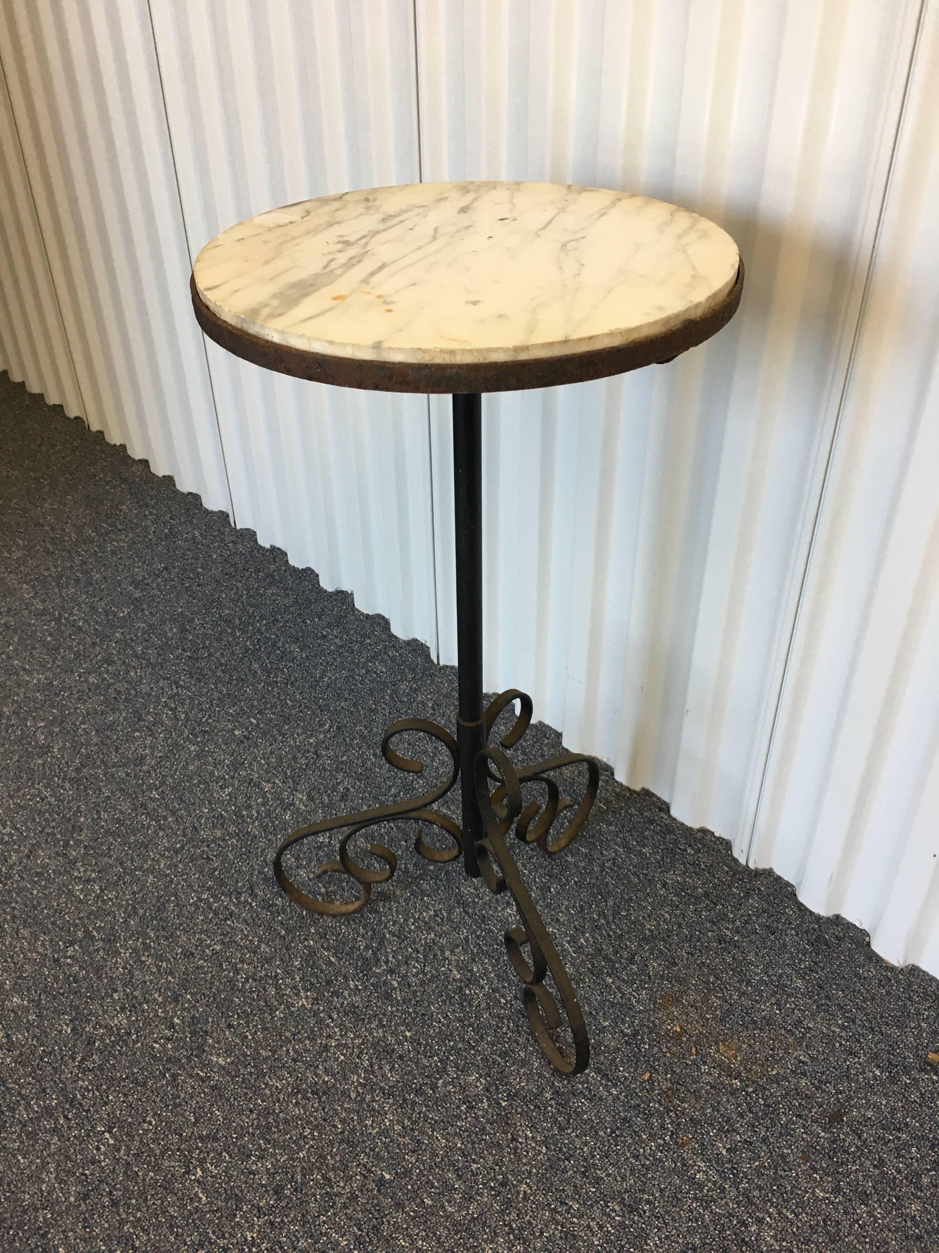 French 19th century iron and marble-top table with scrolled feet.
Table could be used as a side table or plant stand.