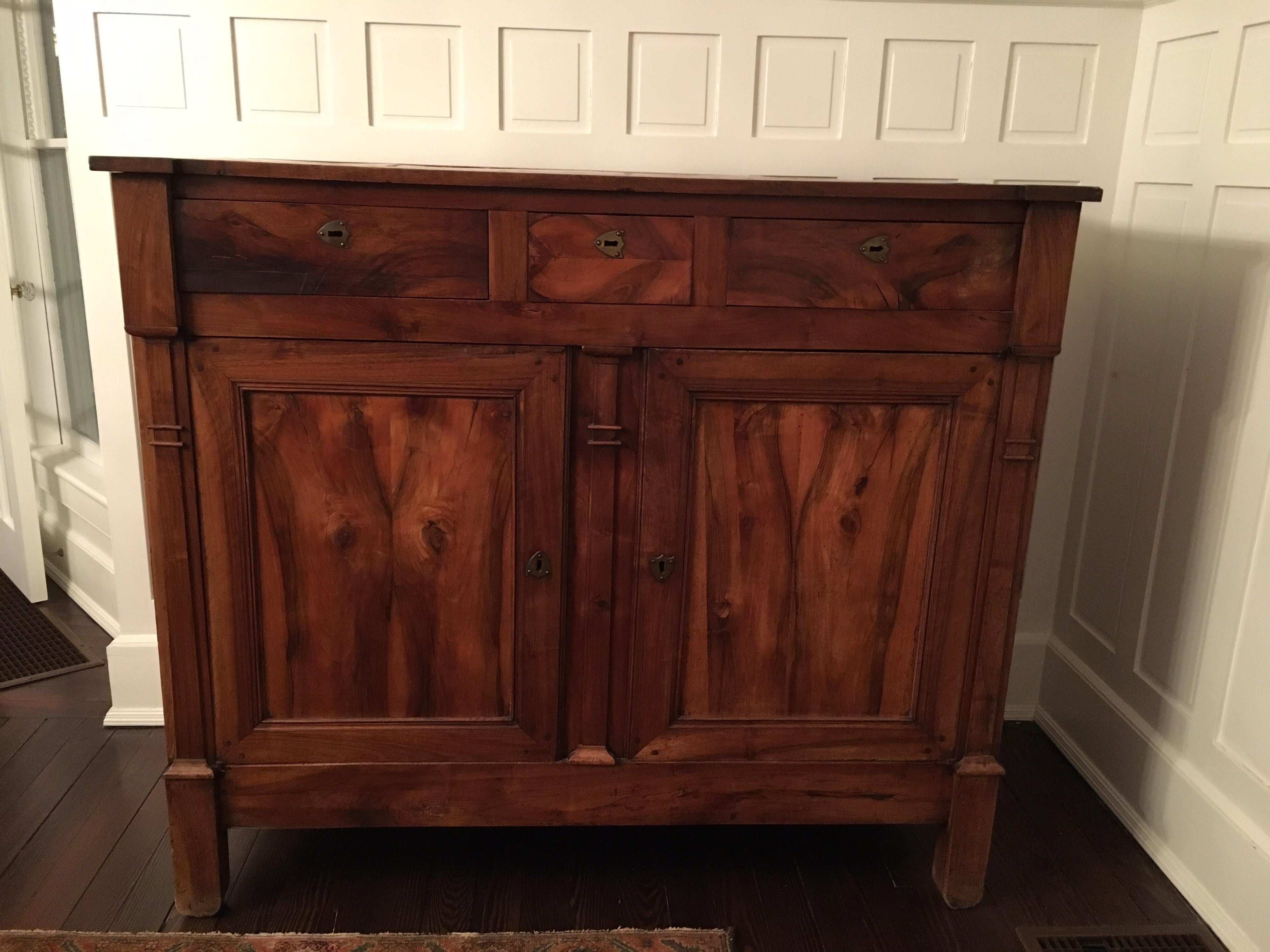 Late 19th century English captains chest.
Locks were installed on the top three drawers to keep important documents safe. Bottom doors hold two long shelves.

 