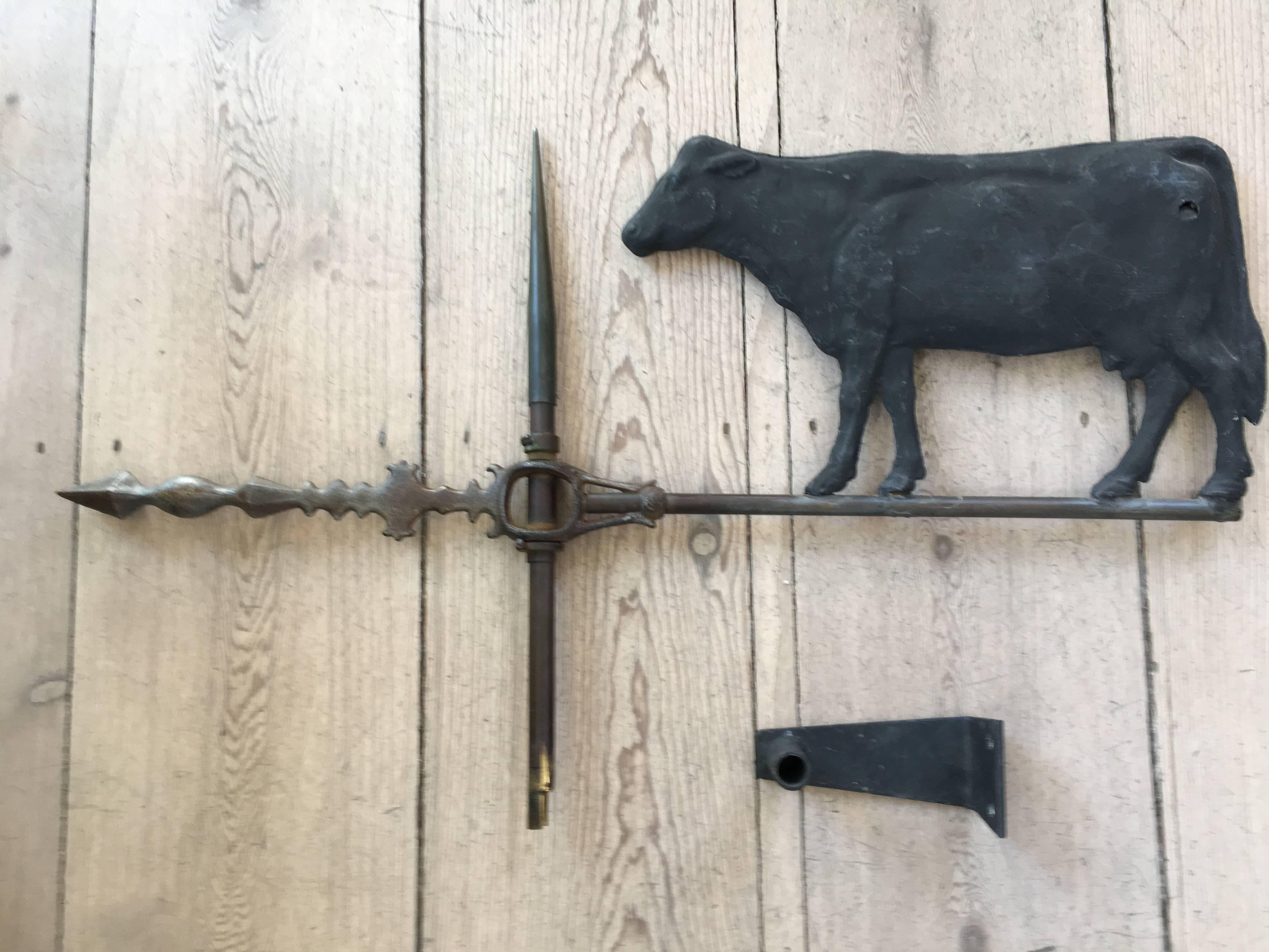 Antique cow weathervane

Wrought iron with new iron post custom fabricated to be hung on the wall.

Measures: 17
