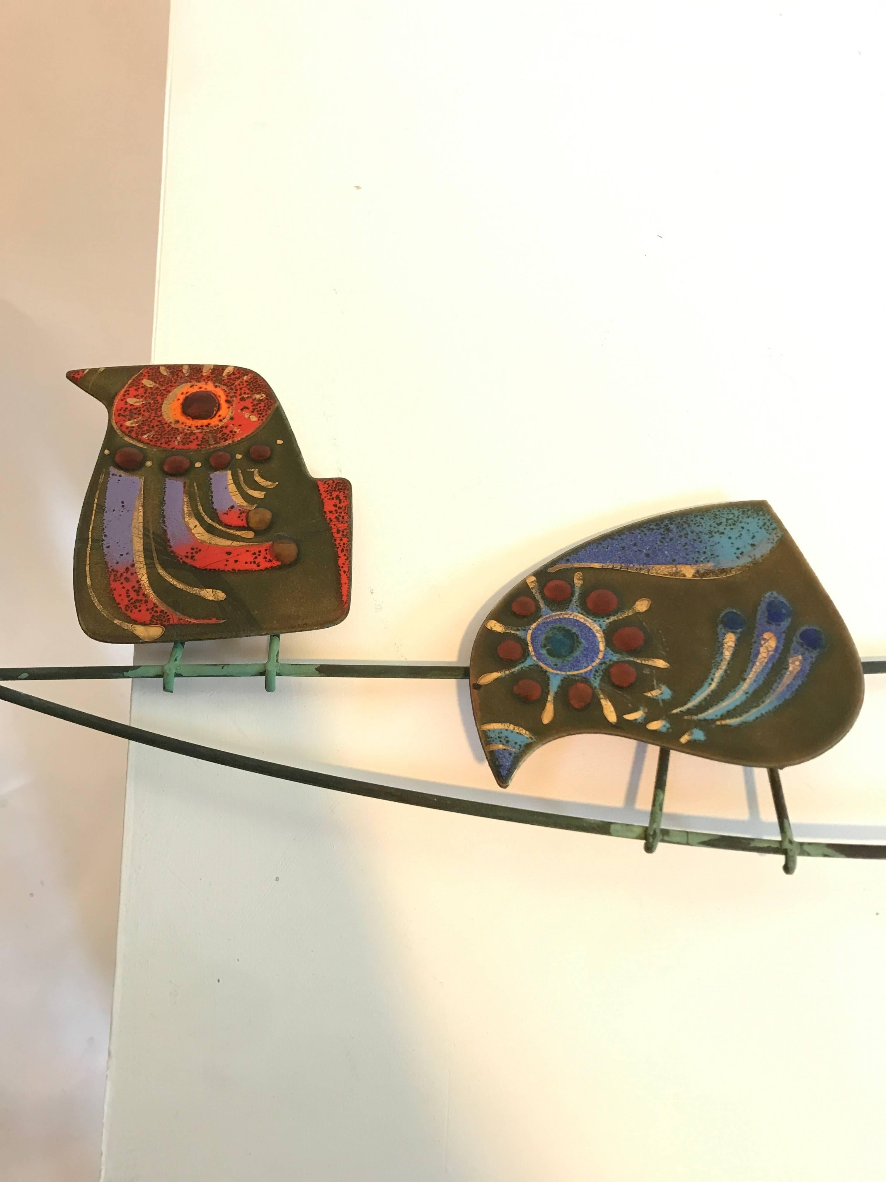 Enameled birds on a wire by Curtis Jere, circa 1986 
Signed C. Jere on last bird on the right (see photo detail) 

Curtis Jeré is the nom-de-plume of artists Jerry Fels and Curtis Freiler. Their collaboration started in the late 1950s, and
