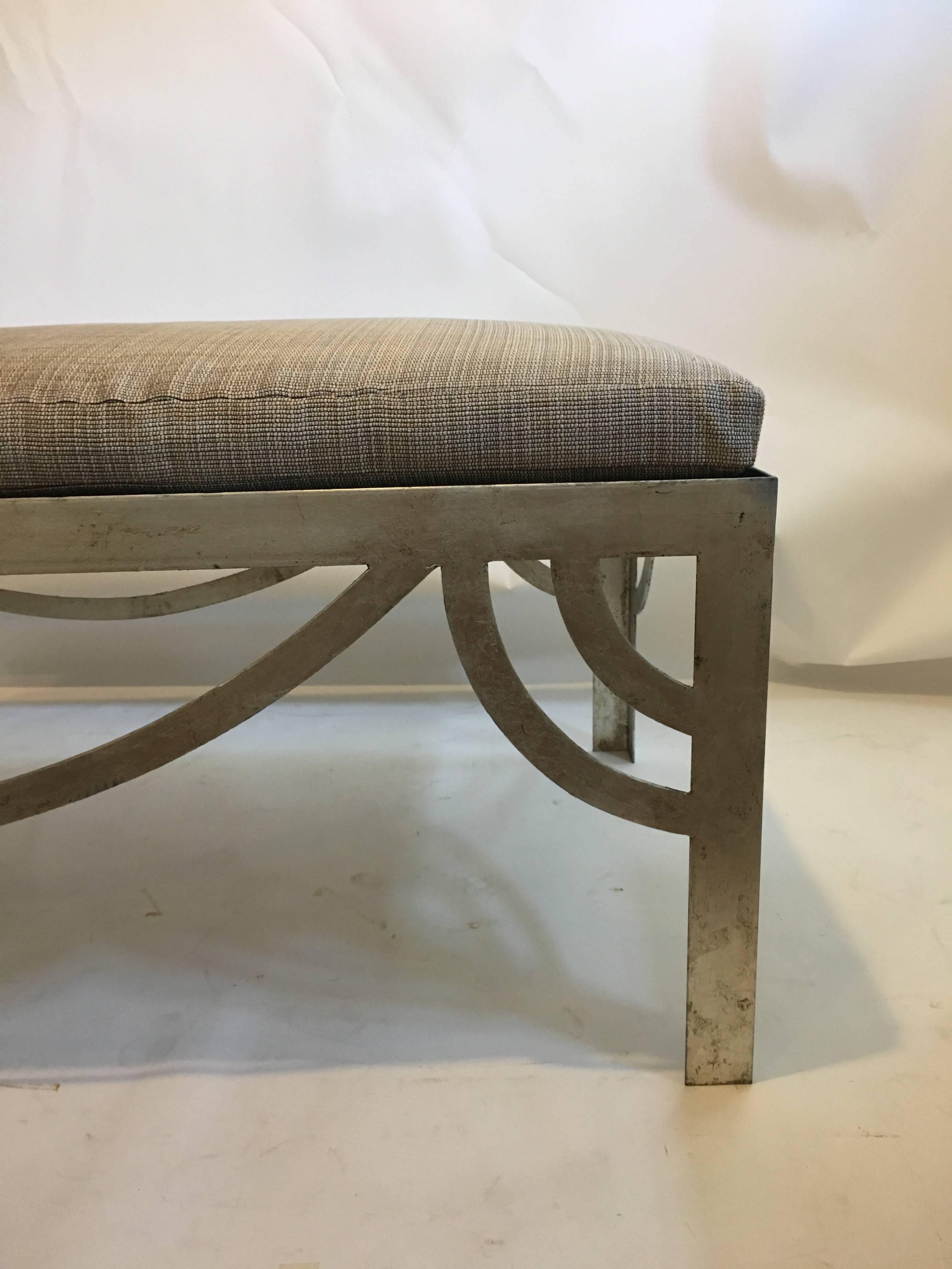Casamidy Ixelles bench with iron base in silver leaf finish with Holland & Sherry fabric attached cushion. 
Measures: 55” W X 27.5” D X 18” H.
 