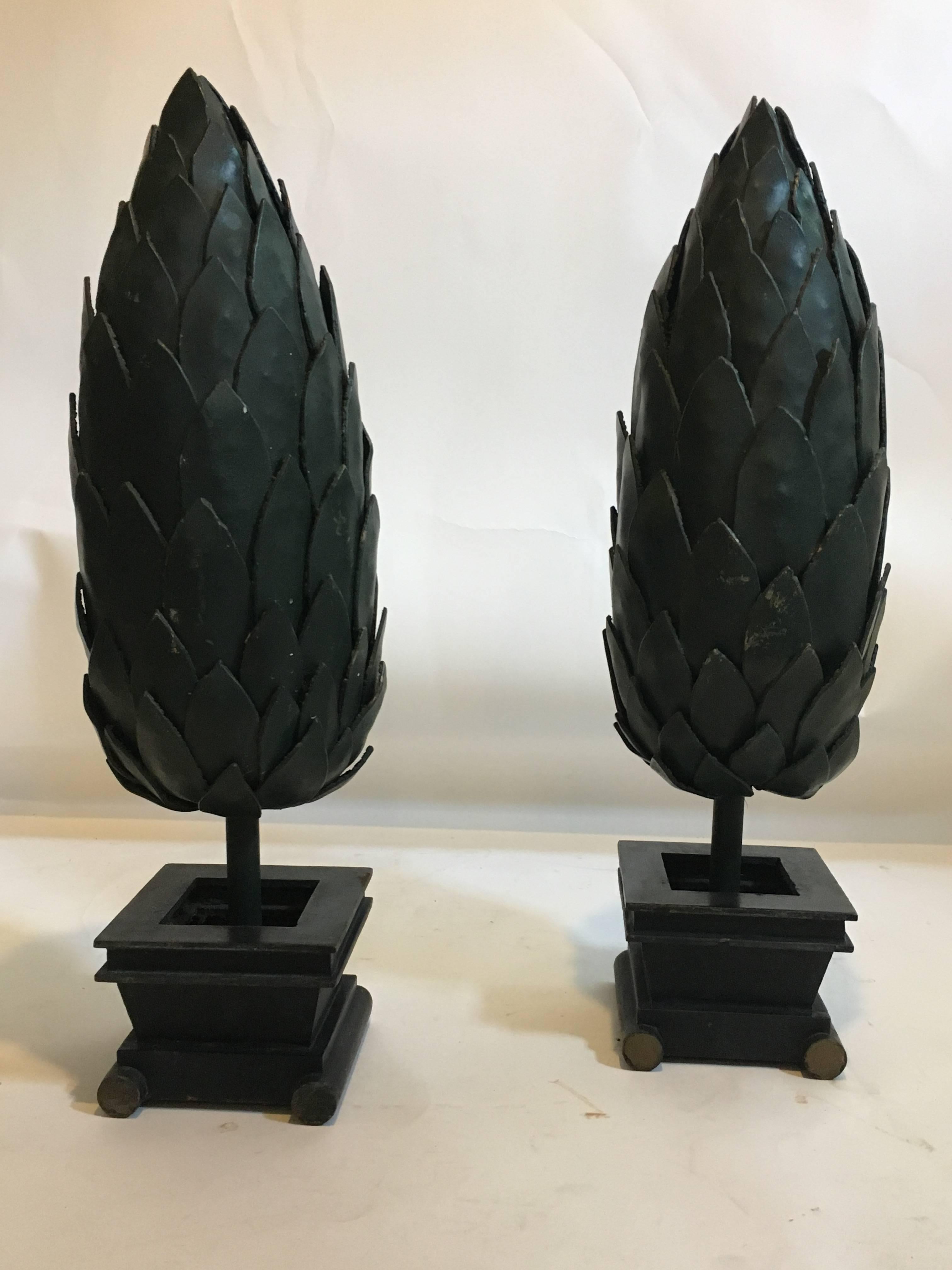 Pair of metal topiaries.

These are small-scale versions of the giant topiaries which stood at the Versace Mansion in Miami. Manufactured by the same metal workers who created the originals. Both custom-made for Versace.