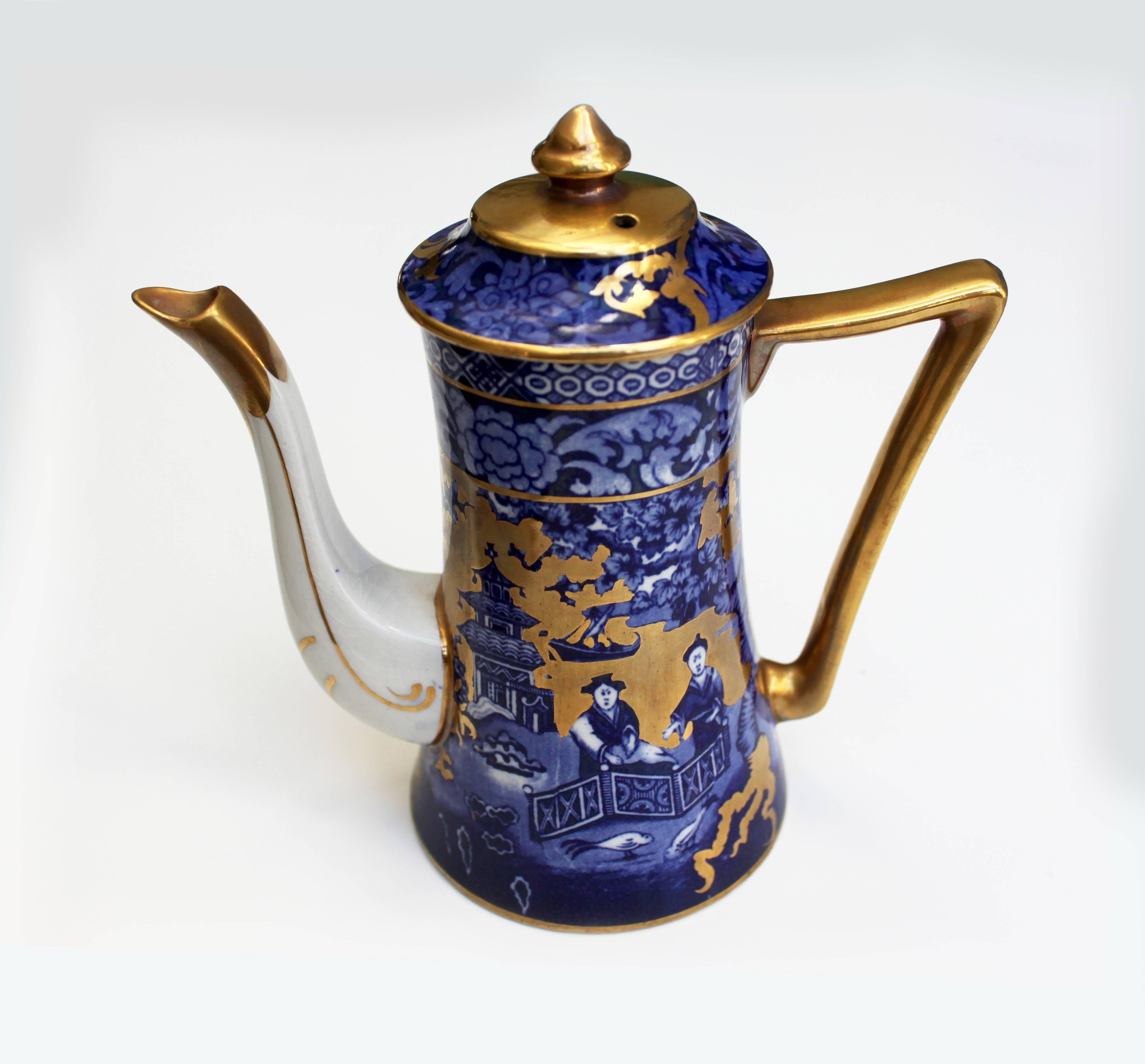 Complete vintage English coffee set for five, immaculate conditions. This coffee set is vintage English and has a clear Chinese decorative influence. It is blue and gold and consists of five cups and saucers, one coffee pot, one cream jug and a