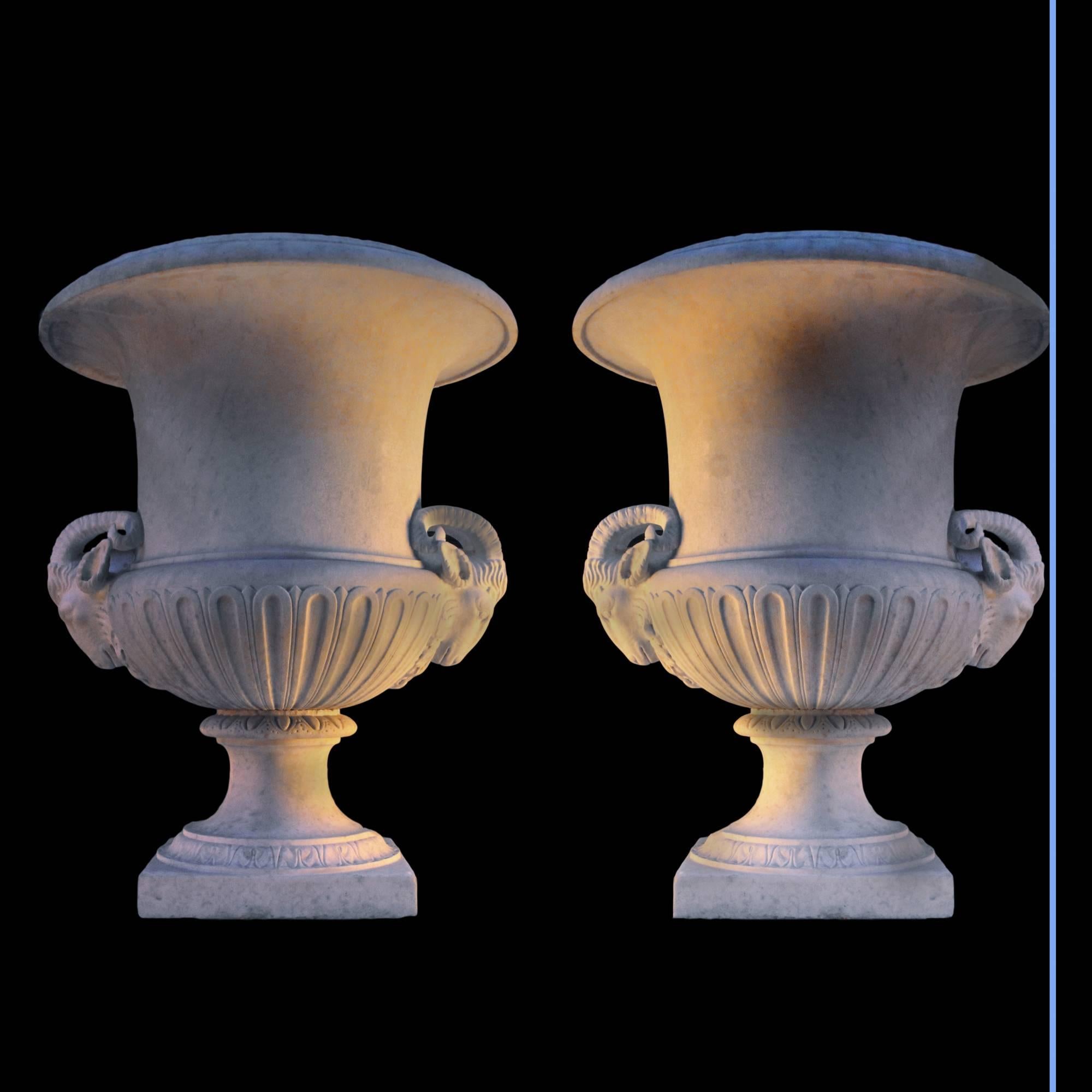 Pair of marble vases with heads of ram.
Statuary Classic white marble with recent wood pedestal
19th century.
Vase: H. 119, W. 85, D. 86 cm.
Pedestal: H. 143, W. 103, D. 103 cm.

The stylization of the head of ram was always moderate according