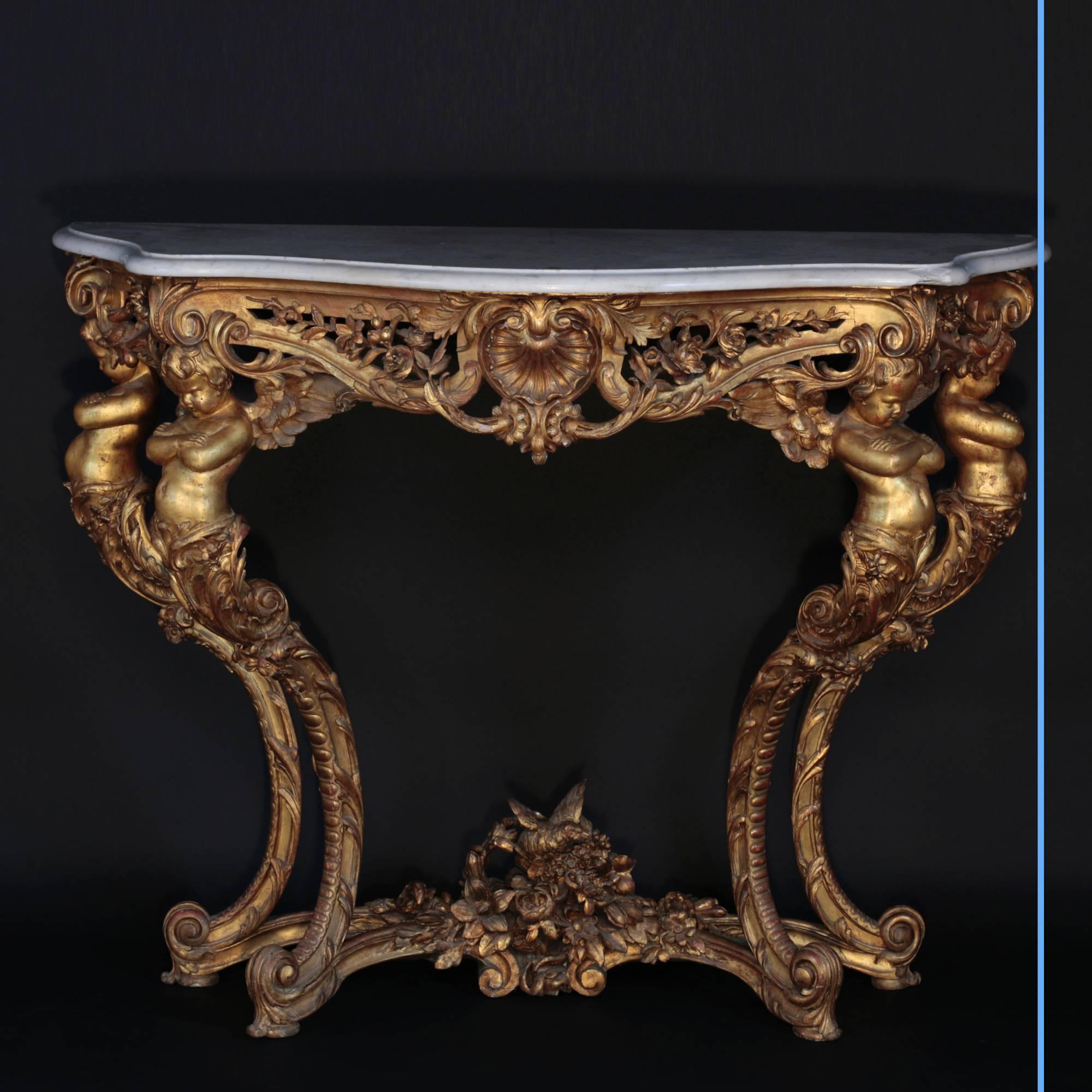 Elegant wall console table with putti.
Carrara white top marble, carved and gilt oak,
19th century,
circa 1880.
Measures:
H 102.5 – L 128 – D 54 cm.