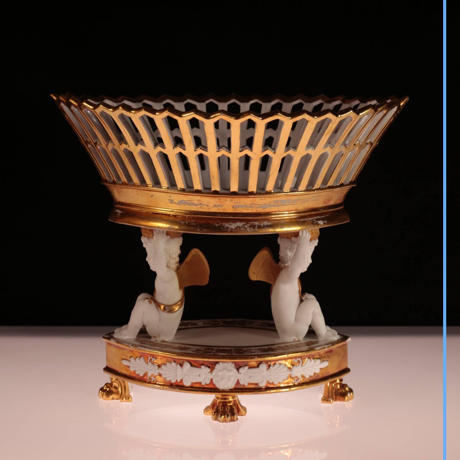 French Restoration Bisque cup with putti
bisque and gilded porcelain,
19th century,
circa 1850.
Measures: H 28 cm, W 36.5 cm, D 23.5 cm.

Our Exhibit: 

Created under the French First Empire, the fashion of fruit and “sweetness” baskets