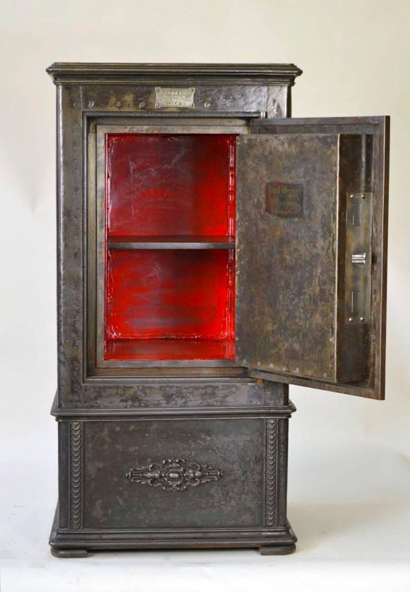 This French antique cast iron safe was made by Godfrin manufactory, Paris.
 It comes with the originals keys and is fully functional.
 The red color inside is not original.
All our safes are vintage and originals, we just work on them to be more