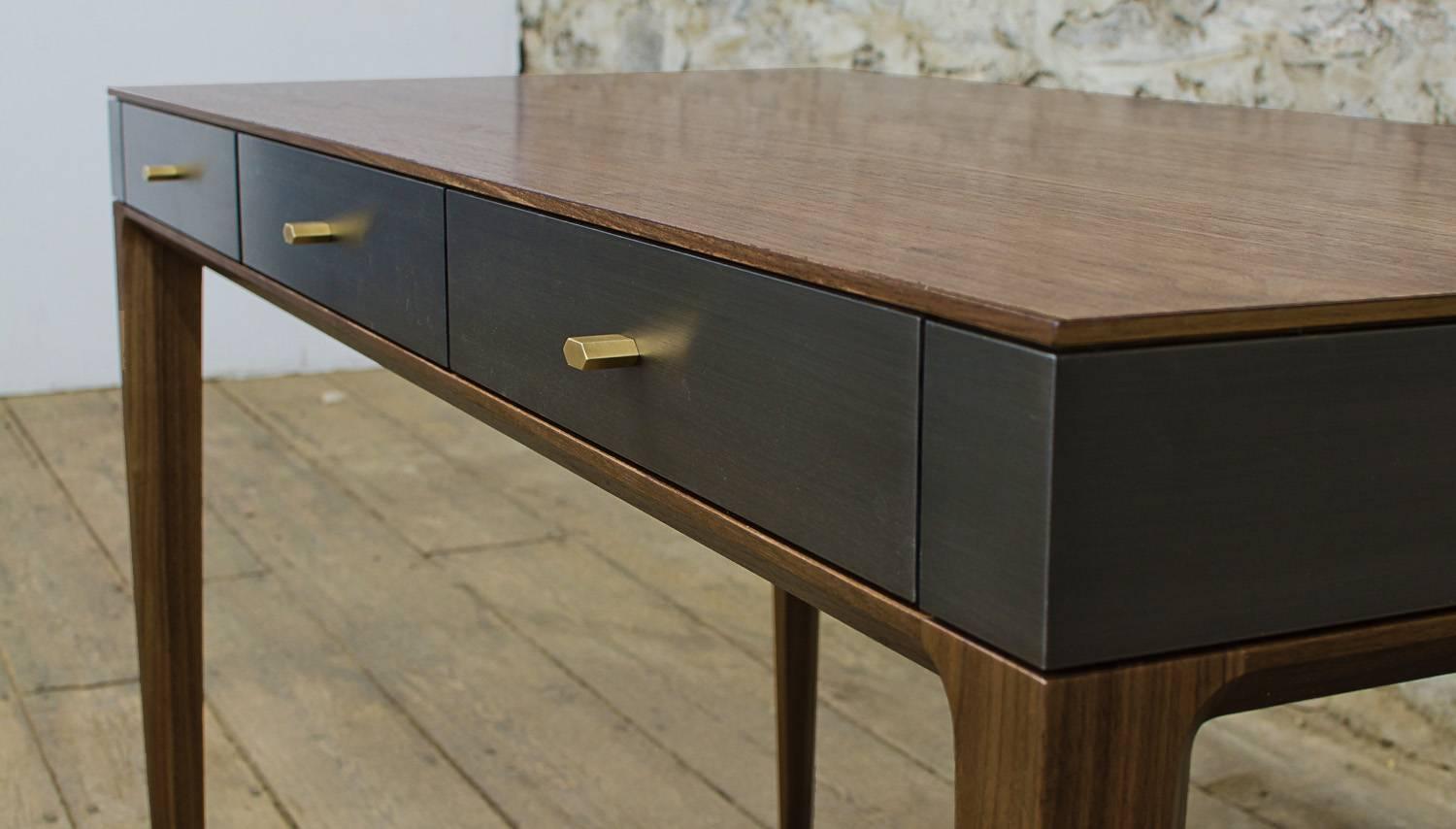 Shown in oiled walnut and gunmetal steel with burnished bronze hardware, the Tulare desk features three solid wood drawers, custom-made hardware and hand applied finishes.
Dimensions (as pictured): 52