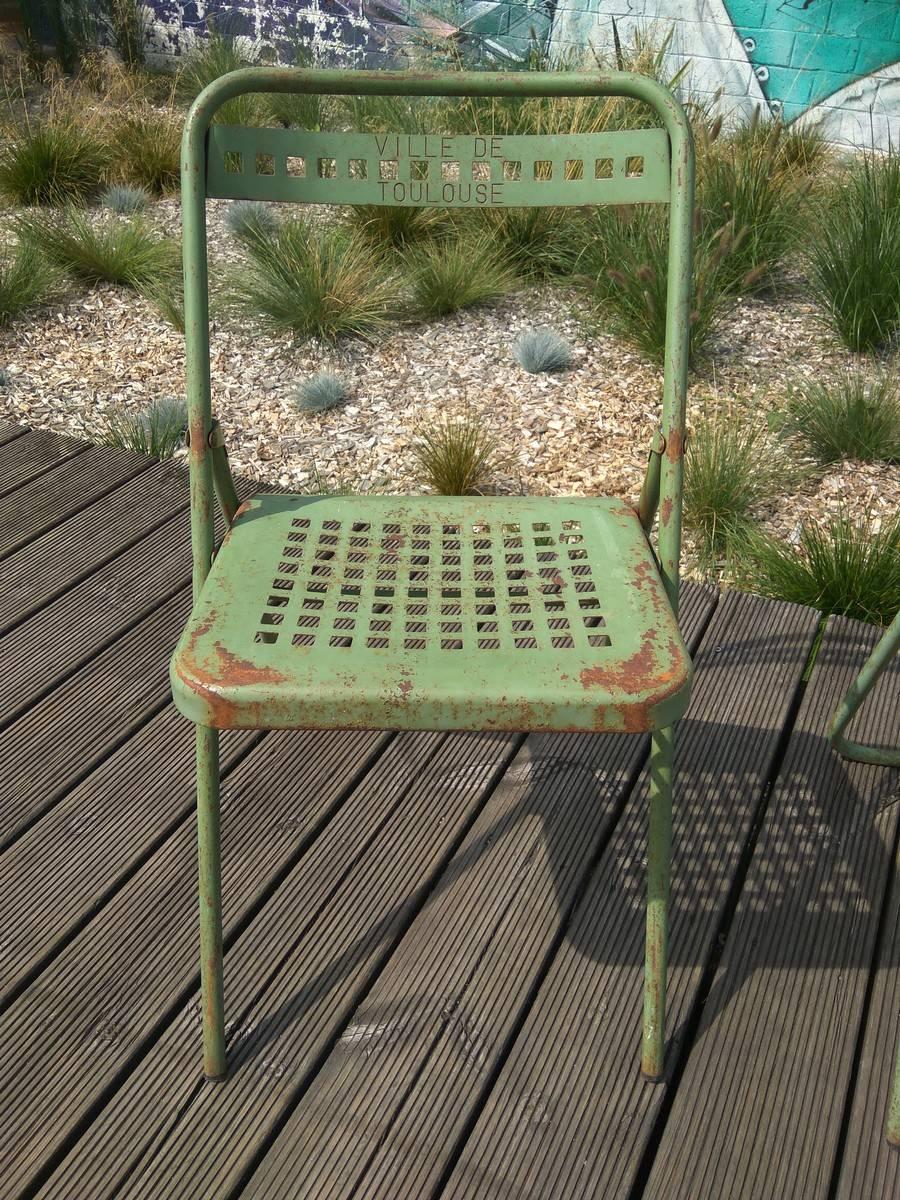 Four green chairs realized for the Public Gardens of Toulouse in France. Sheet metal painted in green. The mark 