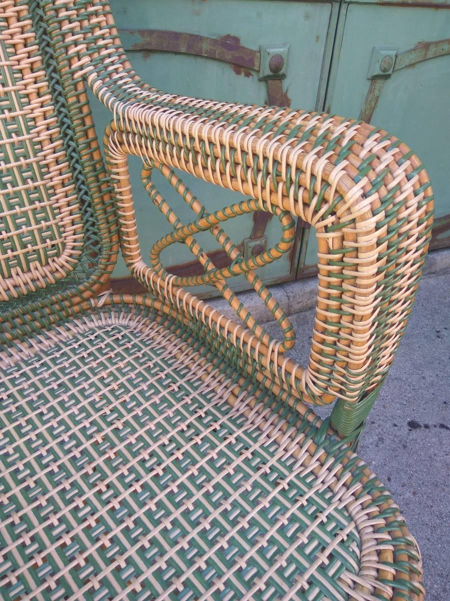 Beautiful rattan armchair realized by Perret and Vibert, the famous French manufactory at the end of the 19th century. Sumptuous rattan work visible in particular in the details of the backrest that recall weaving.
 